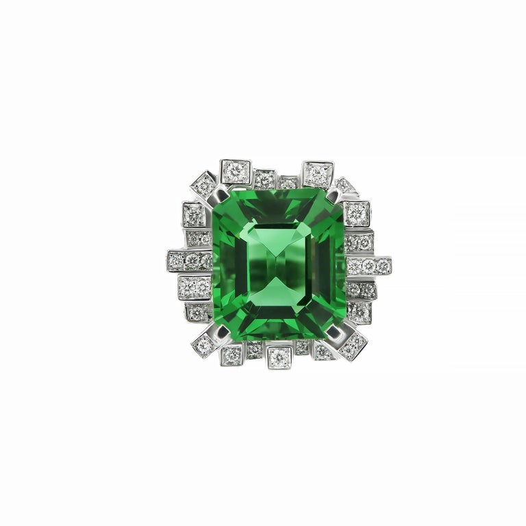 Modern city sophistication inspired the creation of this very rare Moldavite ring. 18k white gold and 2 carat towers of pave’d diamonds in vvs quality enhance this stunning 10.63 carat Moldavite. This incredible green and diamond conurbation is a