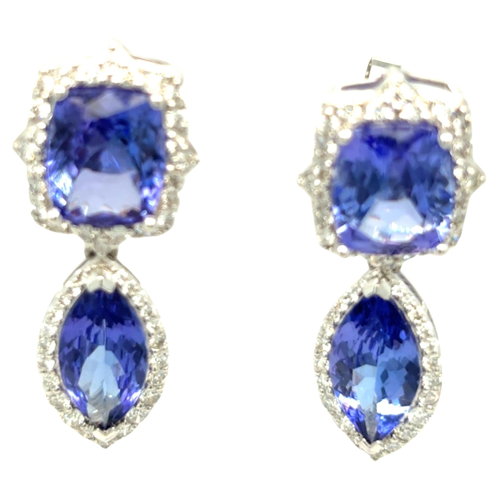 10.63 Carat Tanzanite and Diamond Drop Earrings
These dazzling drop earrings feature two vivid cushion-cut tanzanites gracefully suspending two marquise-cut tanzanites, all surrounded by a halo of brilliant white diamonds totaling 1.13 carats.