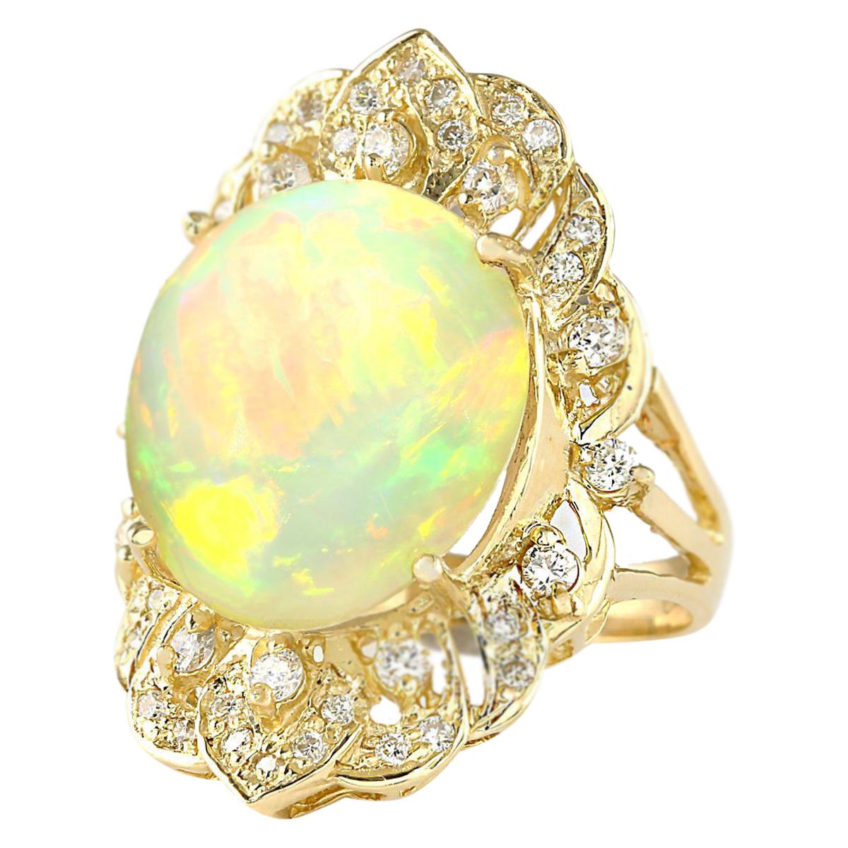 10.65 Carat Natural Opal 14 Karat Yellow Gold Diamond Ring
Stamped: 14K Yellow Gold
Total Ring Weight: 8.2 Grams
Total Natural Opal Weight is 10.05 Carat (Measures: 16.00x14.00 mm)
Color: Multicolor
Total Natural Diamond Weight is 0.60 Carat
Color:
