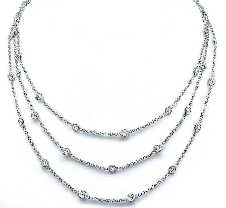 This is an elegant platinum by-the-yard necklace. The necklace features sparkling round cut diamonds that weigh approximately 10.65ct. The color of these diamonds is G-I with VS1-SI1 clarity. The necklace measures 47.5 inches in length and weighs