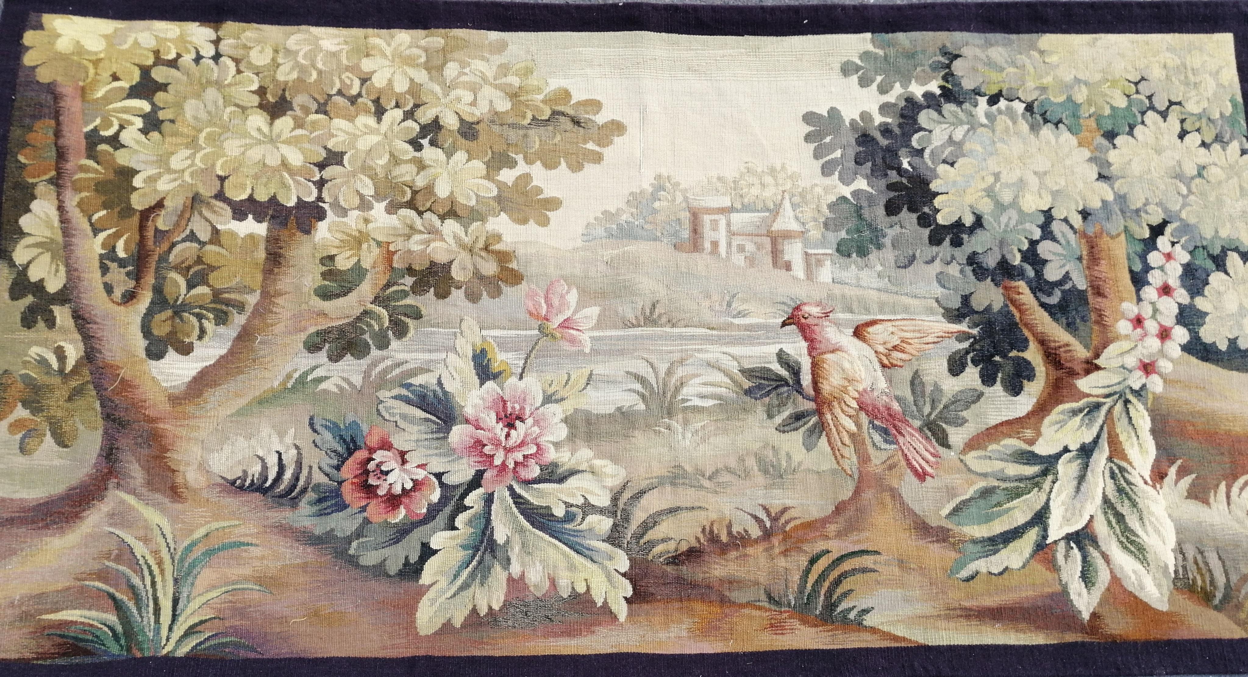 This 19th century French Verdure Tapestry, circa 1890s, is exquisite. It is made of wool and silk, and hangs from a metal tapestry rod with rings or vlcro. The scene is framed by beautiful trees and bird.
