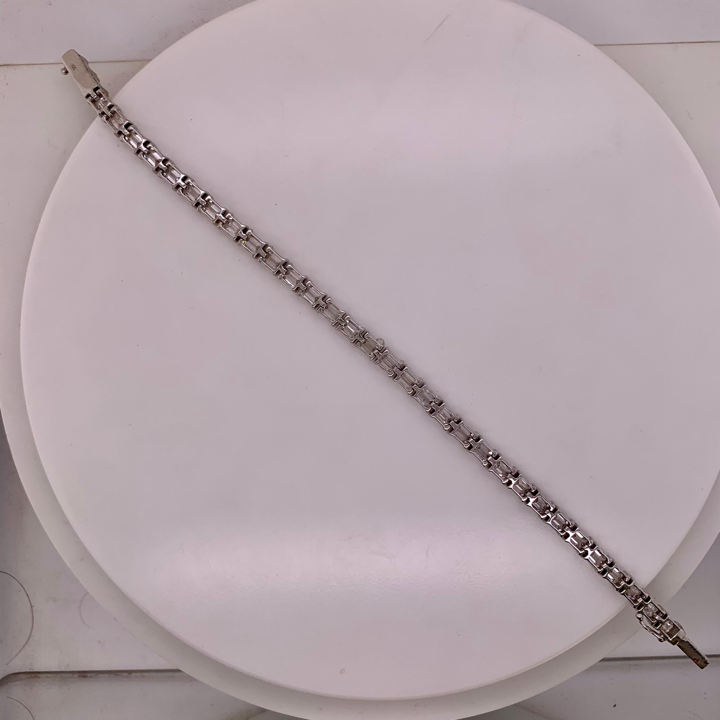 This bracelet features 10.67 carats of diamonds that are emerald cut. 

Crafted in 18k white gold with a gross weight of 12.75 grams, it combines luxury with timeless elegance. 

With its refined design, this diamond bracelet is perfect for any