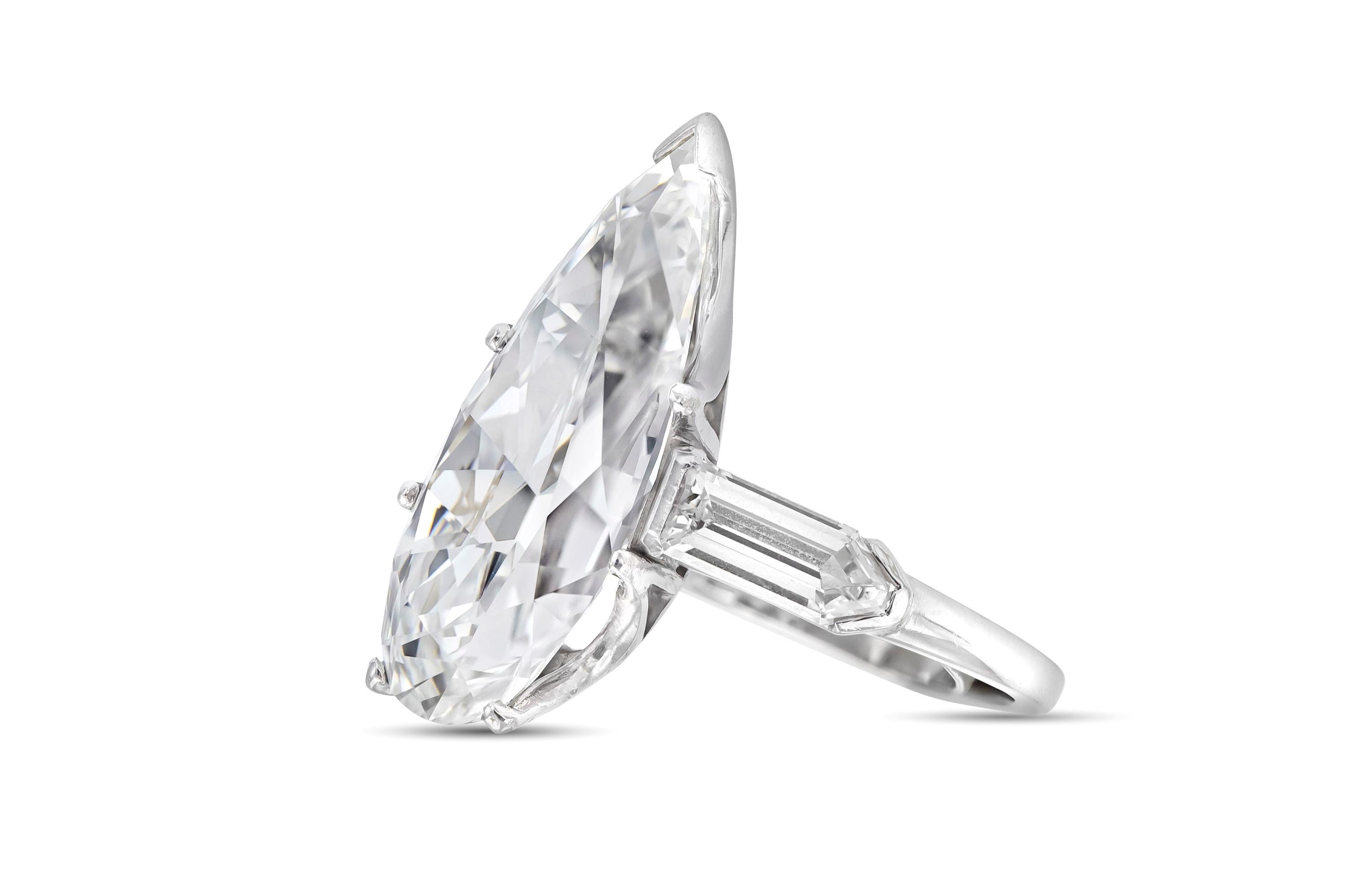 Finely crafted in platinum with a GIA certified Pear Shaped diamond weighing 10.67 carats.
G color, VS1 clarity
GIA #1226180588
The ring features shield-cut diamonds on each side.