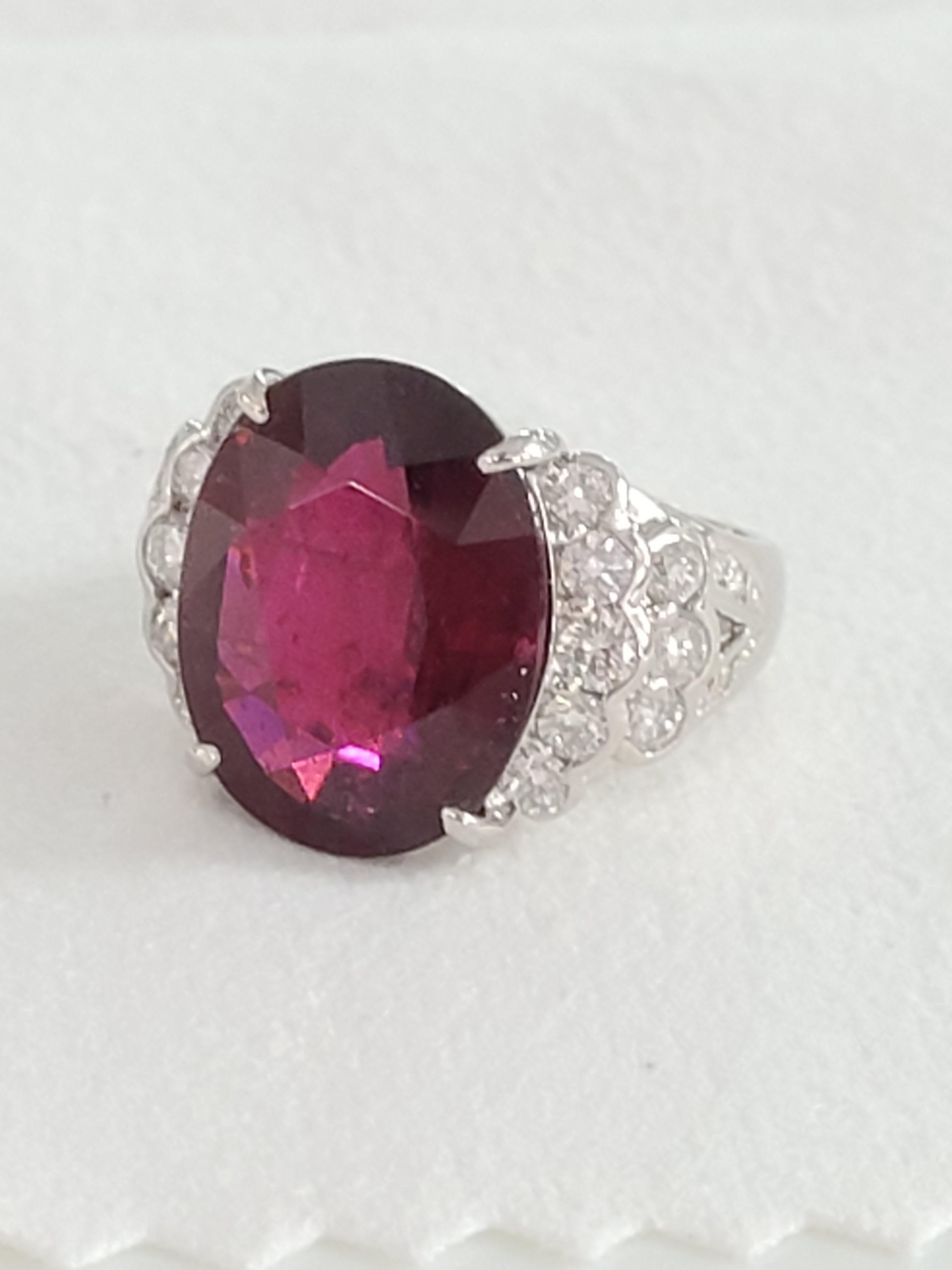 A gorgeous classic design Rubellite ring made in Platinum PT900. The rubellite weight is 10.58 carats and diamond weight is 1.04 carats. The ring dimensions in cm 1.5 x 1.8 x 2.2 (LXWXH). US size 6.