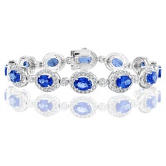 10.69 Carat Oval Blue Sapphire and Diamond Halo Bracelet in 14K White Gold