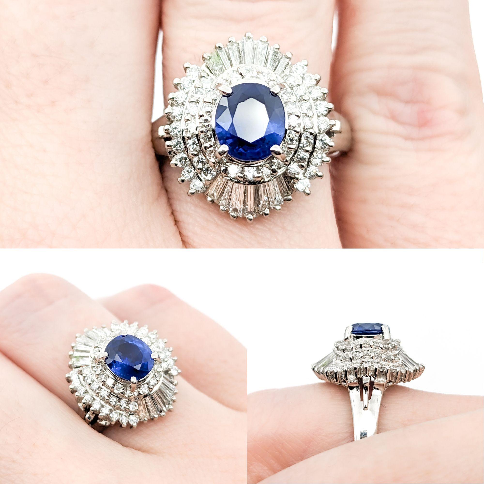 1.06ct Blue Sapphire & .85ctw Diamond Ring In Platinum

This exquisite ring is crafted from 900 platinum and showcases a stunning 1.06ct sapphire centerpiece. It is beautifully complemented by 0.85ctw of round and baguette diamonds that boast SI