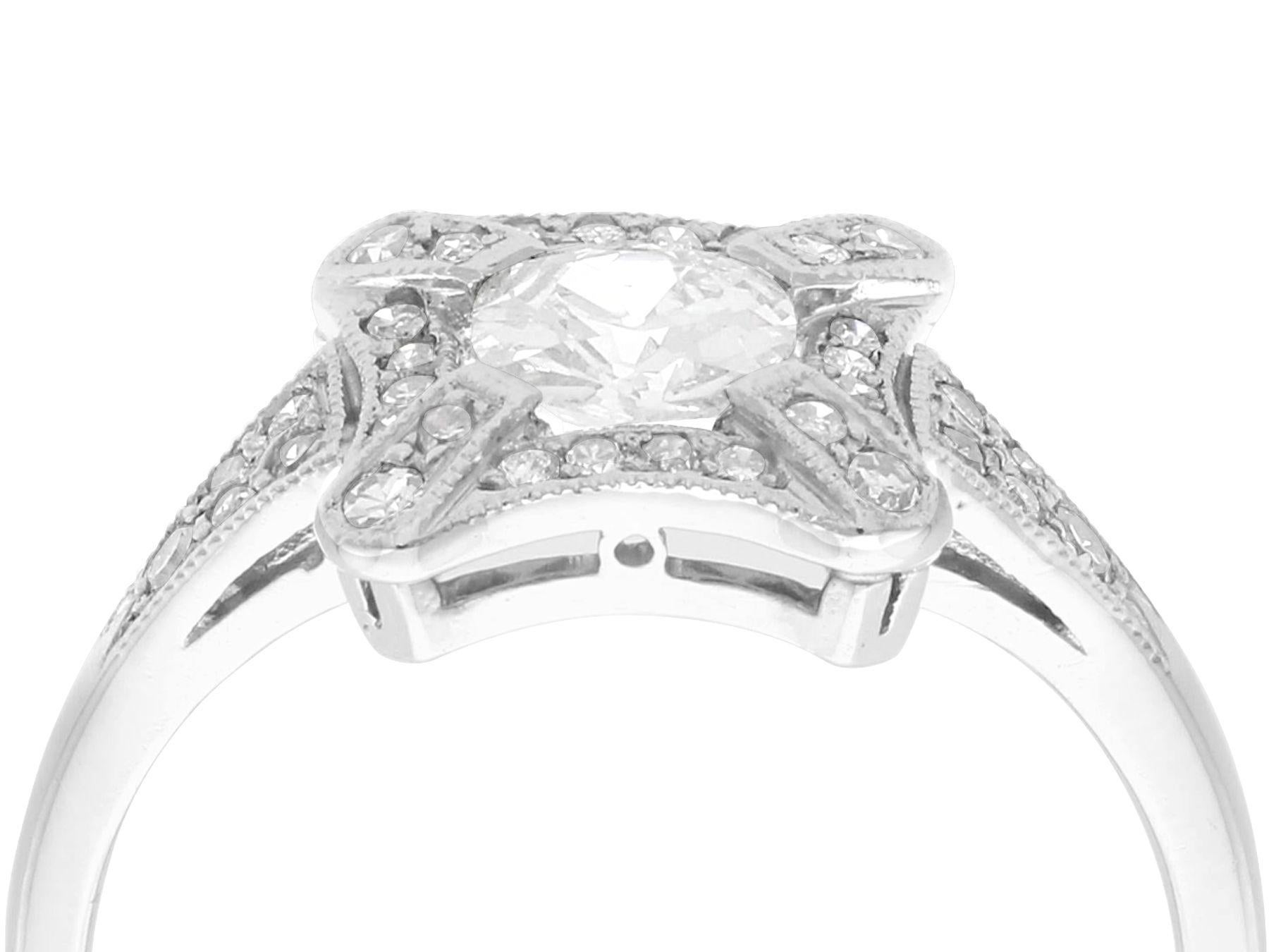 A stunning, fine and impressive antique and contemporary 1.06 carat diamond and platinum cluster ring; part of our diverse antique jewelry and estate jewelry collections

This stunning, fine and impressive diamond ring has been crafted in
