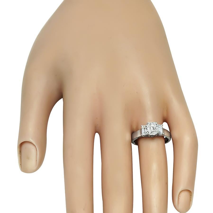 This is a gorgeous 14k white gold engagement ring. The ring is centered with sparkling emerald cut diamond that weighs approximately 1.06ct. The color of the diamond is H-I with SI1 clarity. The center diamond is accentuated by dazzling emerald cut
