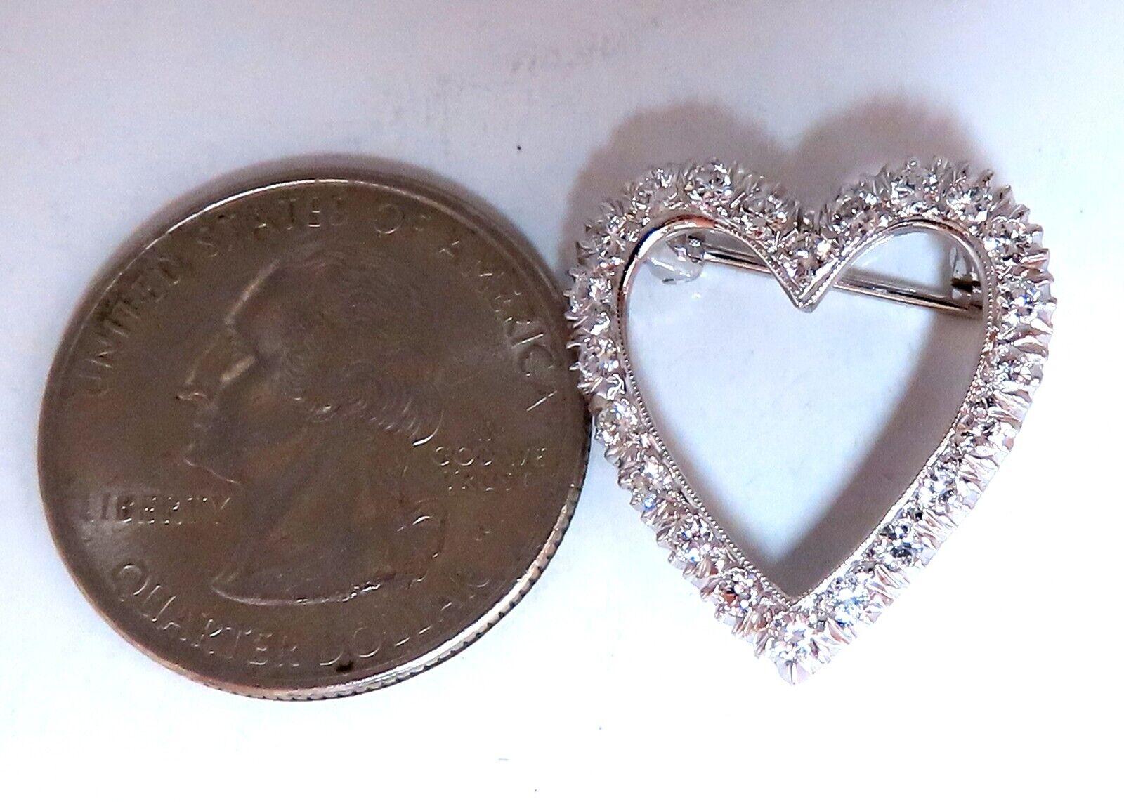 1.06ct. diamonds Heart brooch pin optional pendant.

Rounds, Full cut Brilliant.

G-color Vs-2  clarity.

14kt white gold 

3.9 grams.

Overall: .8 X .8 inch

Excellent made 

Gorgeous Details