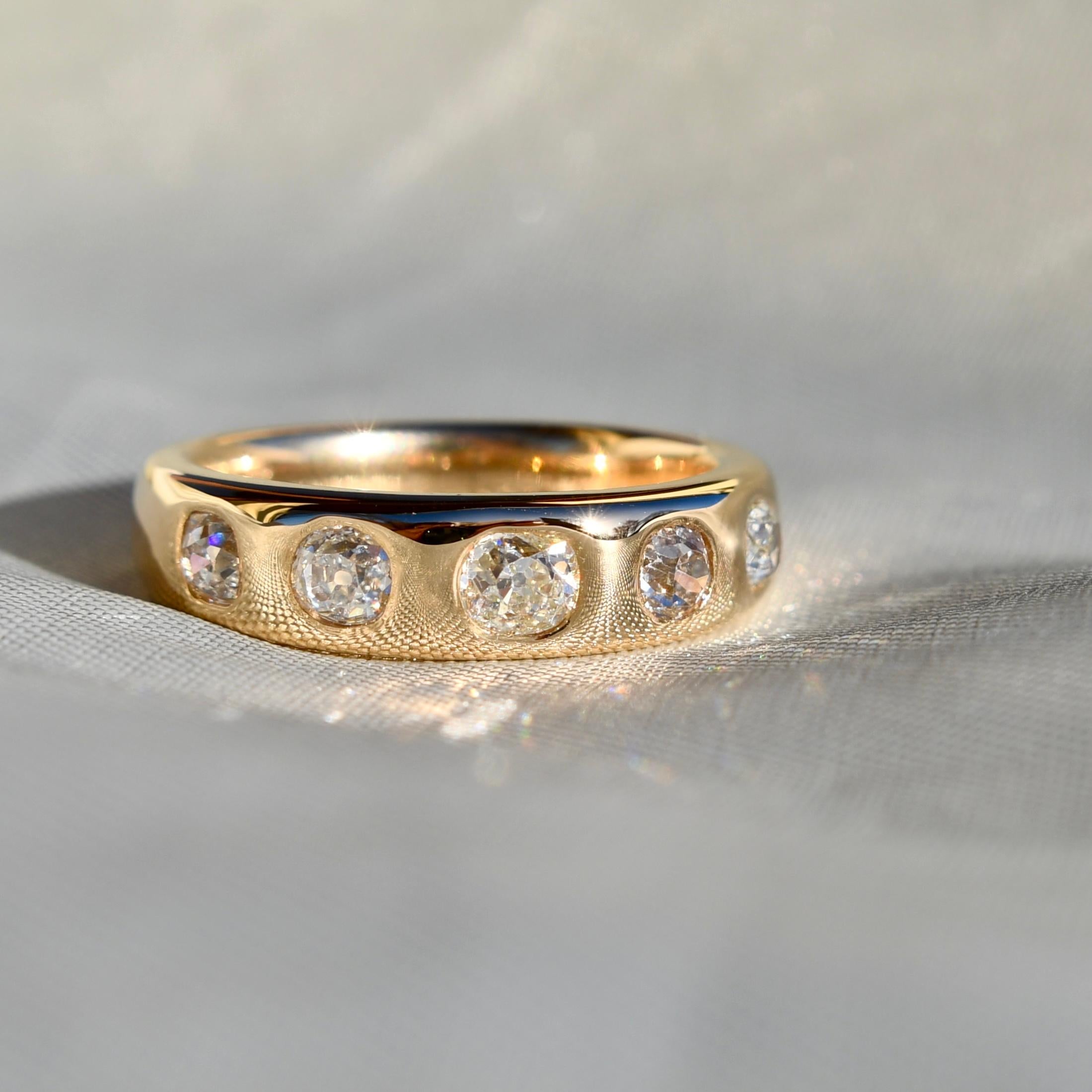 A newly made ring by Beaubijouxantique featuring antique old mine cut diamonds. 

All diamonds are H-M in color and VS1- SI1 in clarity, the diamonds have no signs of wear.

- One GIA certified old mine cut diamond, 0.29 ct (M/ SI1) 
- Four old mine
