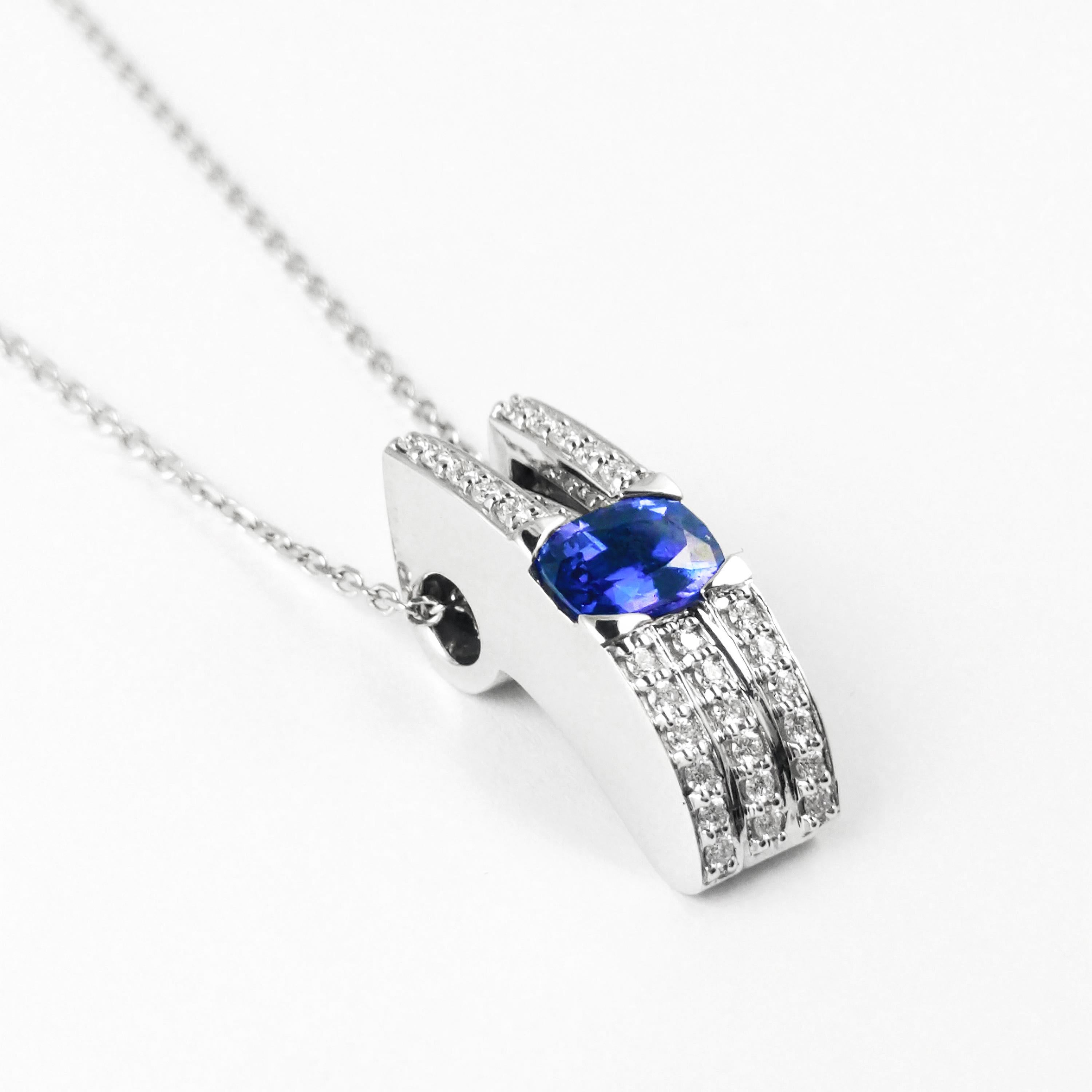 This ladies 14K white gold slide pendant features a rare 1.06ct purple color-change sapphire handset east to west. The necklace is accented with round bead-set diamonds to add contract and softness. The approximate diamond weight is 0.40cts total, G