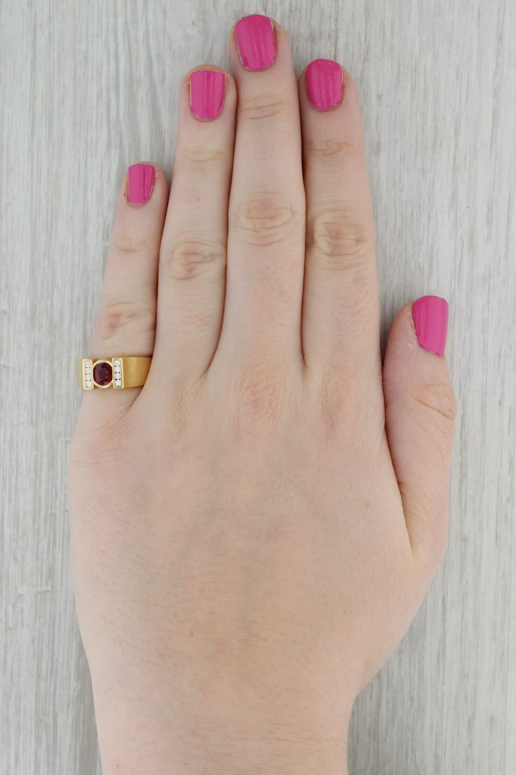 Gemstone Information:
- Natural Ruby -
Carats - 0.92ct 
Cut - Round Brilliant
Color - Red
Treatment - Heated
GIA - 2231171649

- Natural Diamonds -
Total Carats - 0.14ctw
Cut - Round Brilliant
Color - E - F
Clarity - VS2

Metal: 18k Yellow