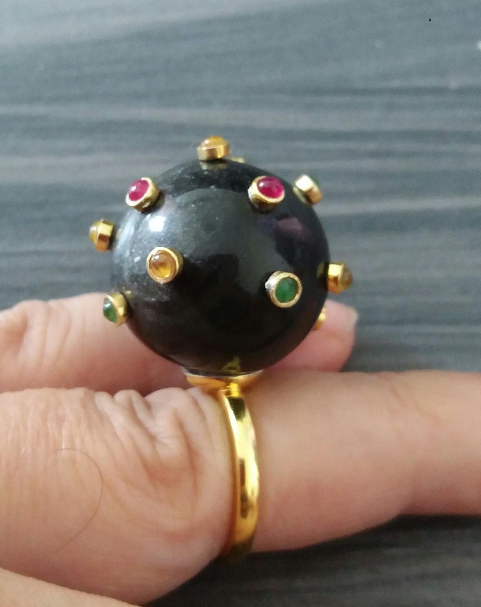 Extremely Stylish and Unique Ring composed by a Natural Quartz  Sphere measuring 25 mm in diameter and weighing 107 Carats ,decorated with 15 small round Rubies,Emeralds and Yellow Sapphires set in 14K yellow gold bezels.

In 1978 our workshop