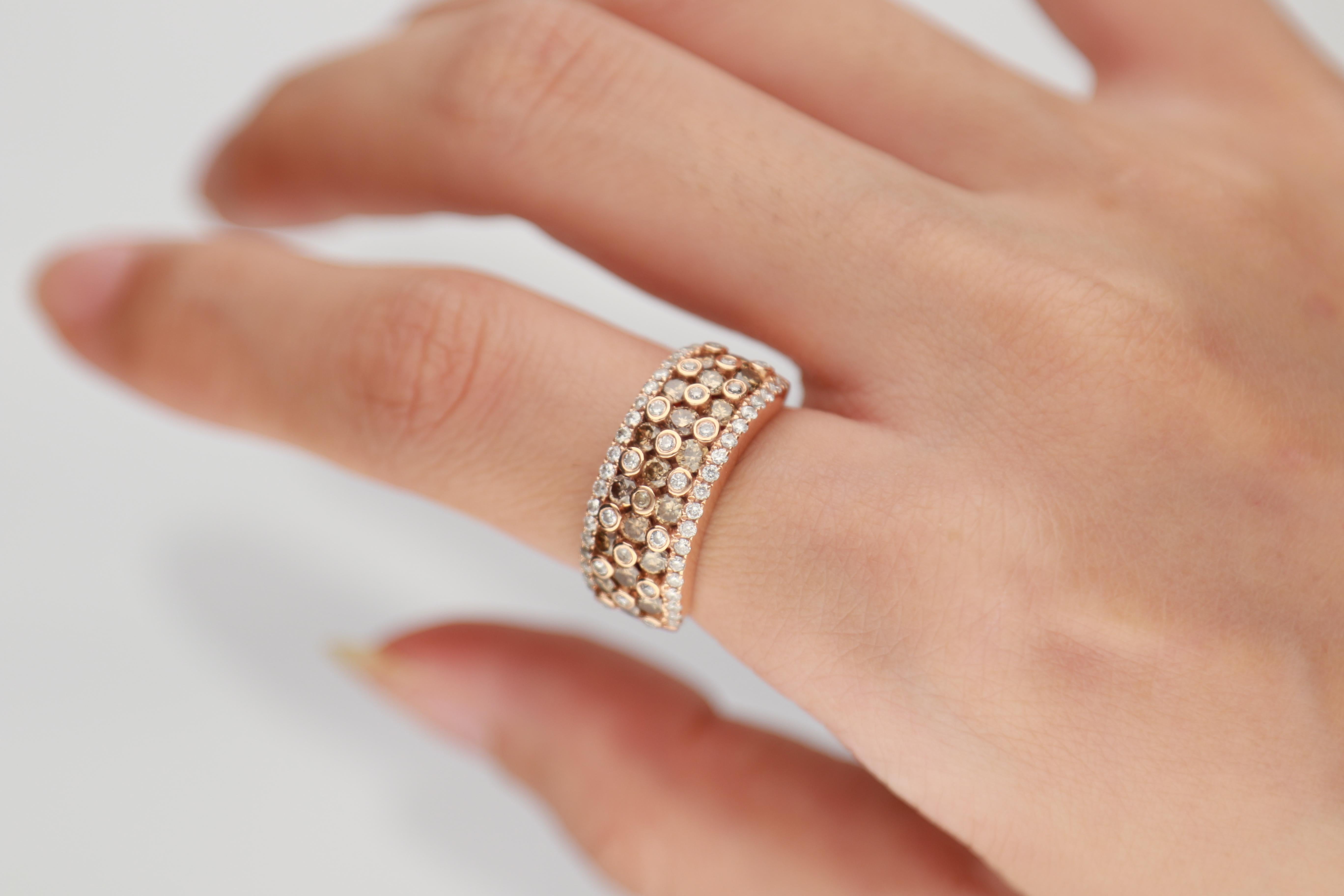 This beautiful Ring is crafted in 14-karat Rose Gold and features an 19 Pcs  1.07 Carat Round Cut Brown Diamond surrounded with 58 Pcs  Round -cut White Diamonds 0.46 Carat in GH-SI quality. 
This ring comes in size 7 and can be resized to 6 & 8. It