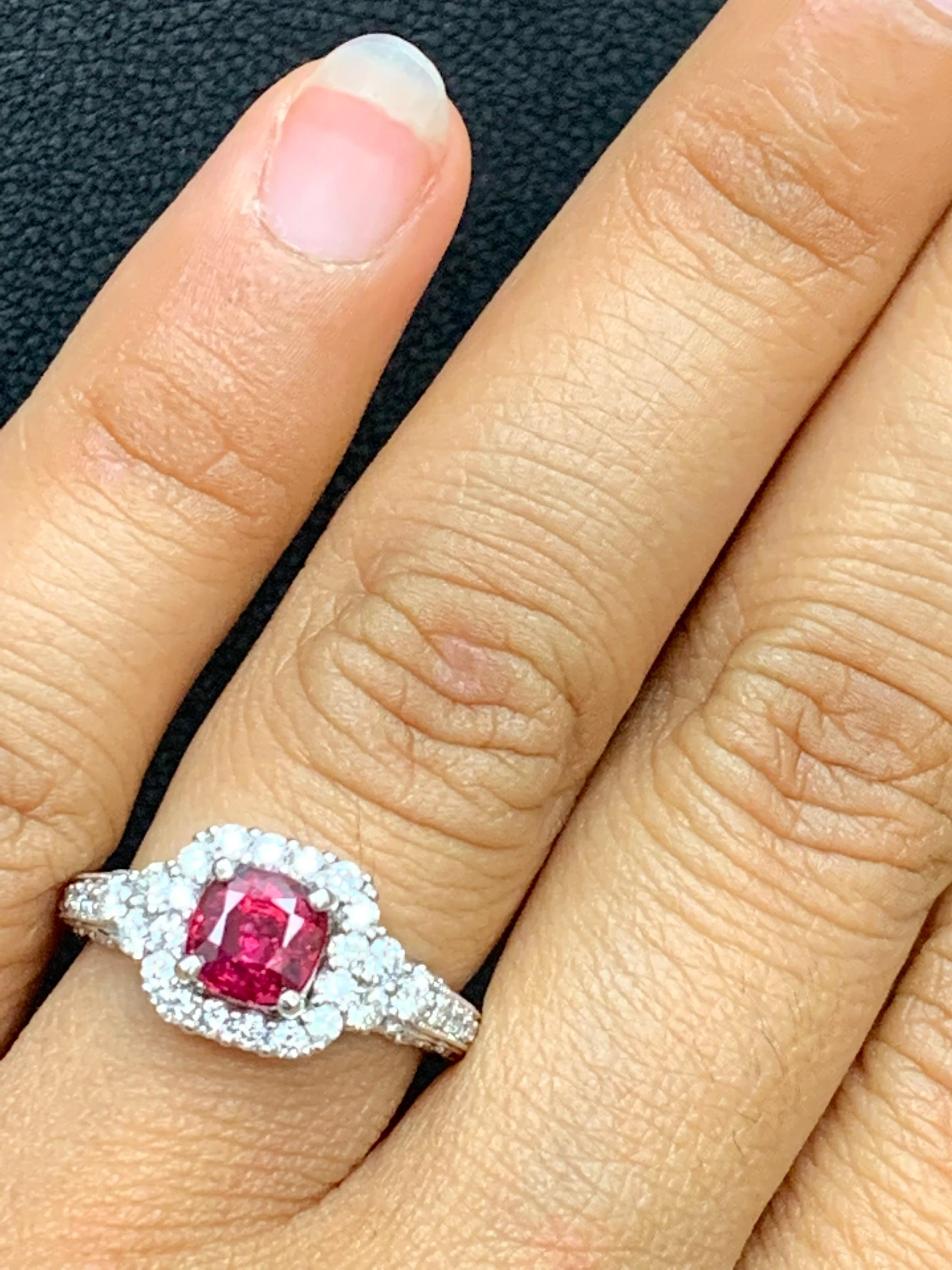 A vibrant 1.07-carat cushion cut natural ruby takes center stage as it elegantly contrasts the sparkling diamonds around it. Set in a chic shank setting accented with rope design with more brilliant diamonds.  50 Diamonds weigh 0.74 carats in total.