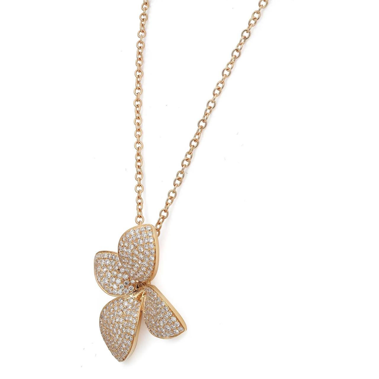 Introducing our exquisite and modern 1.00 Carat Diamond Flower Necklace crafted in lustrous 18K Yellow Gold. This necklace features a captivating asymmetrical flower design adorned with radiant round diamonds. The diamonds, sparkling with
