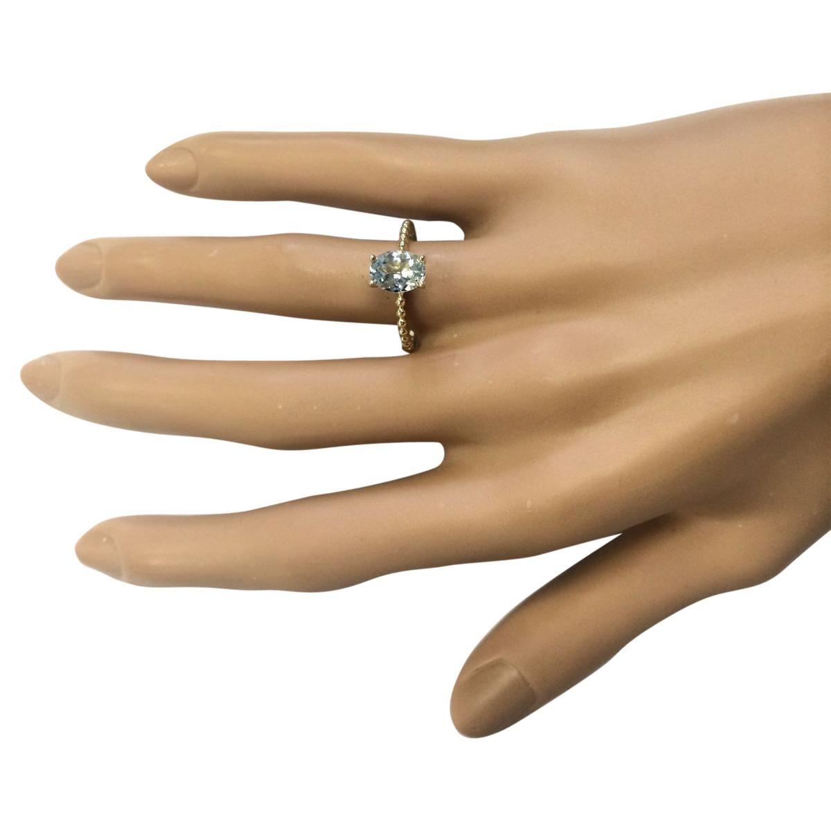 Oval Cut Natural Aquamarine Ring In 14 Karat Yellow Gold  For Sale