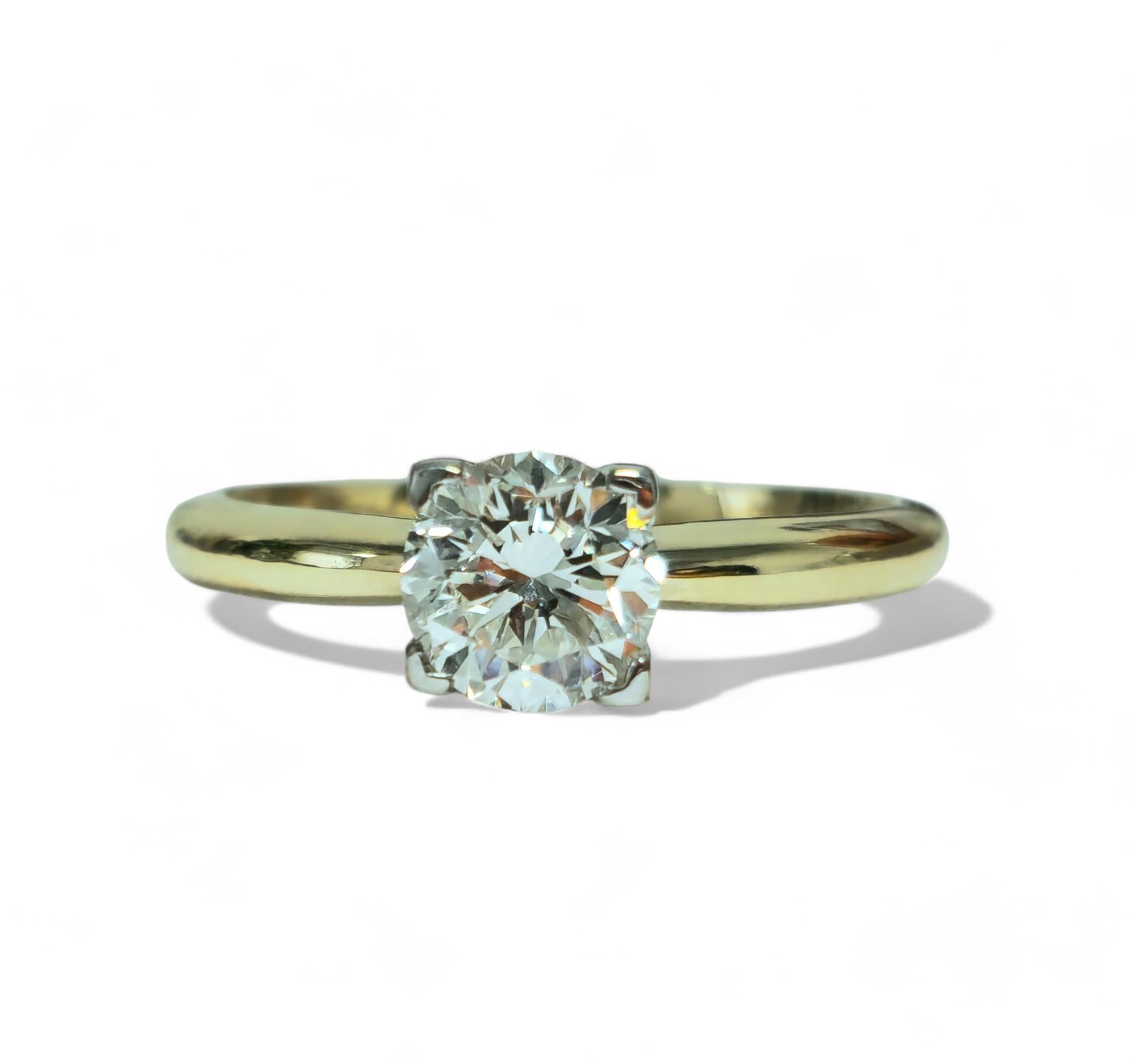 Crafted in 14k Yellow Gold, this stunning engagement ring features a brilliant 1.07 carat round-cut diamond, boasting VS1 clarity and G color. Mined from the earth, this diamond shines beautifully against the gold band. With a ring size of US 7, it