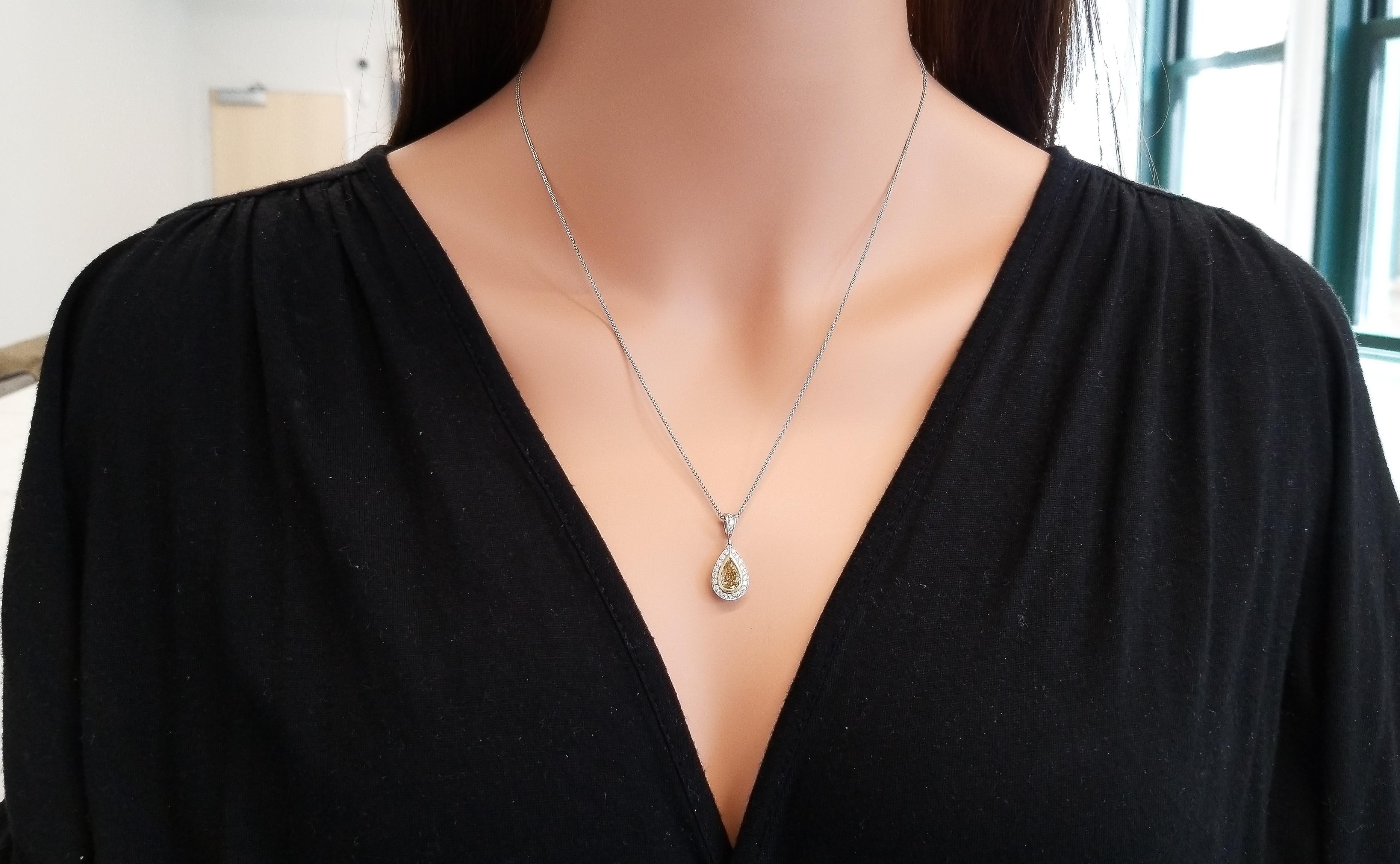 If you are looking for a pendant that will delight the senses, then this one is for you! This elegant 18 karat white and yellow gold teardrop pendant is impossible not to notice. It features a 1.07 carat measuring 8.45 x 5.75 millimeter natural