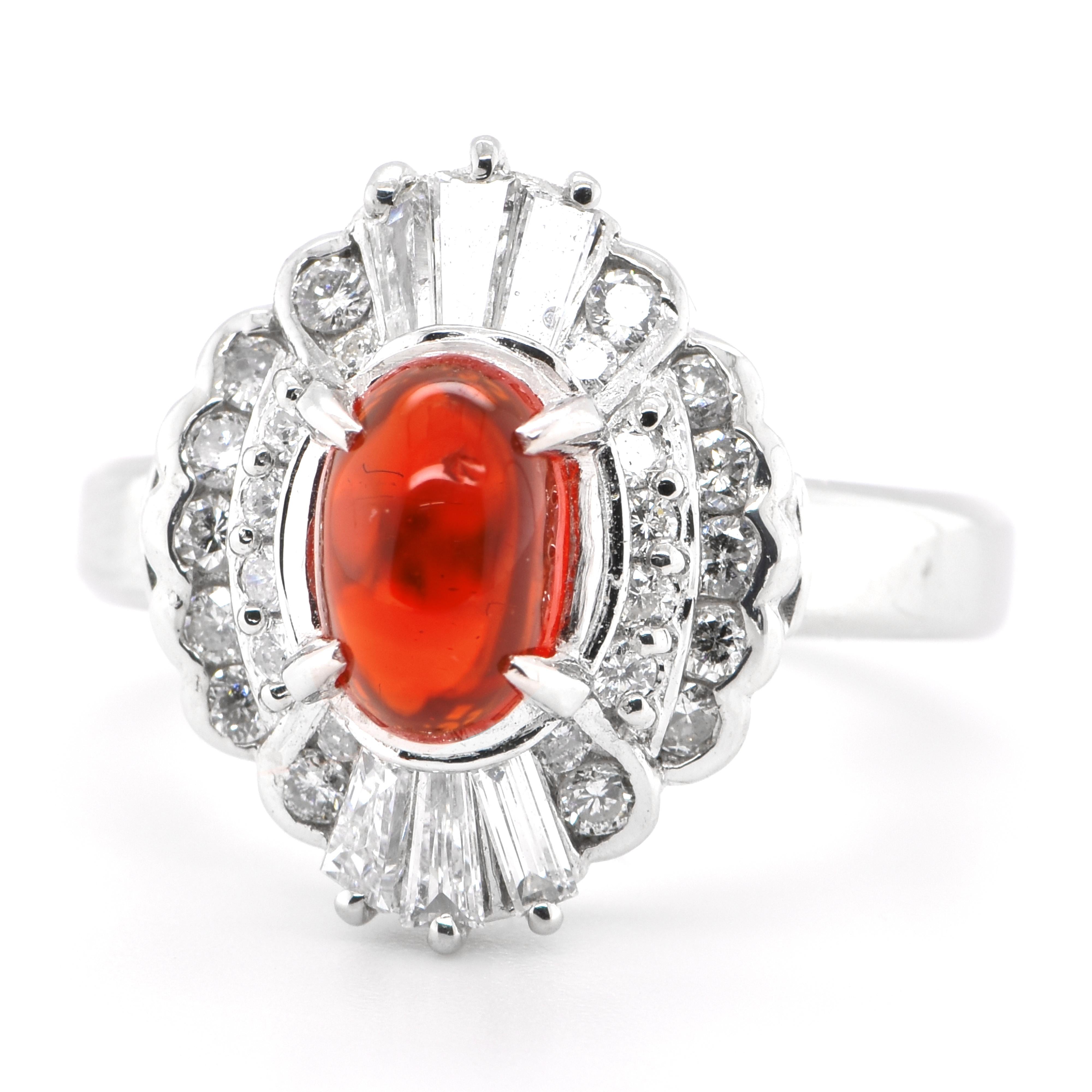 A beautiful vintage ring featuring a 1.07 Carat Natural Mexican Fire Opal with very good play of color and 0.69 Carats of Diamond Accents set in Platinum. Opals are known for exhibiting flashes of rainbow colors known as 