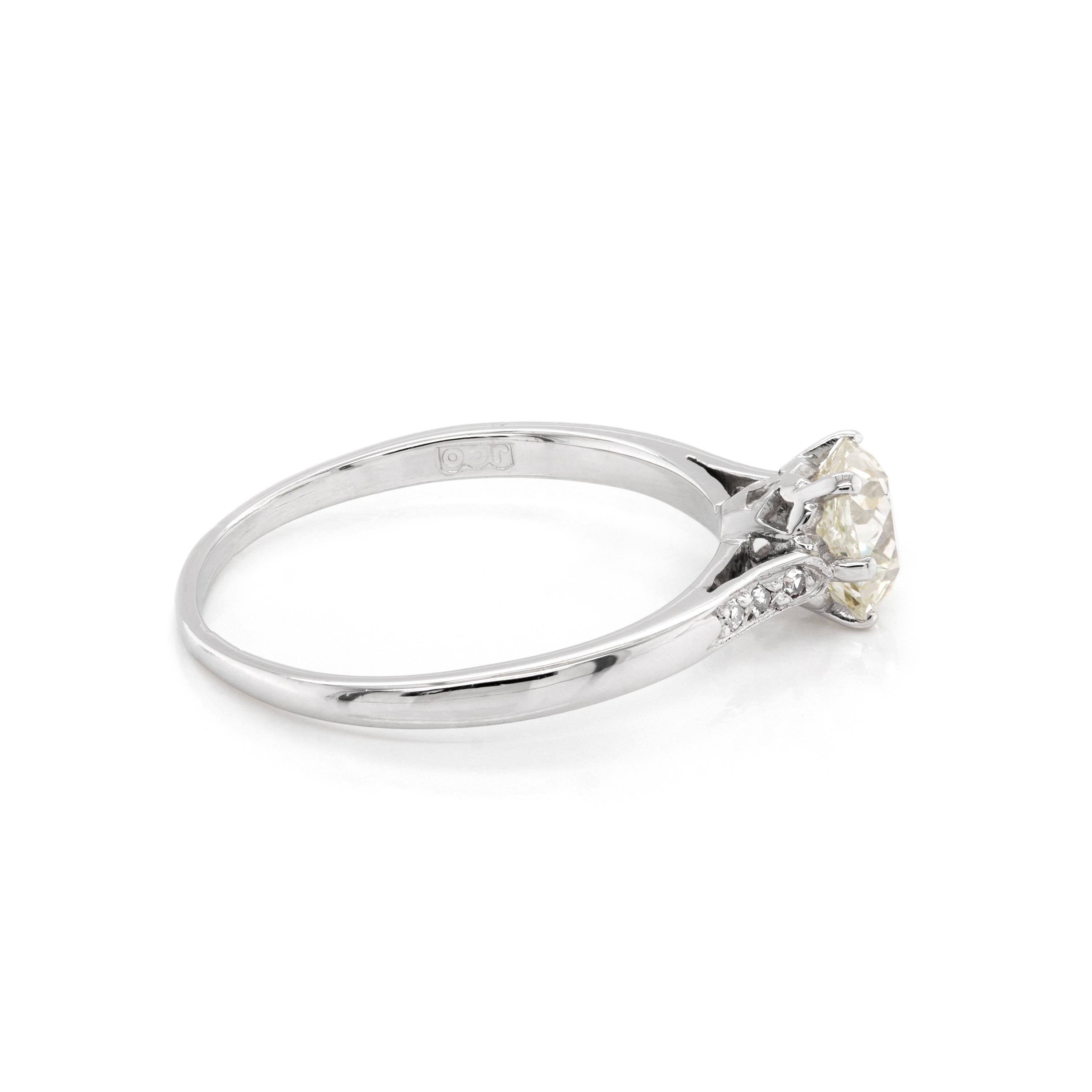 Engagement ring featuring a lively Victorian old mine cut diamond weighing 1.07 carat set in a 6 claw, open back setting. The diamond is beautifully accompanied by 3 grain set eight cut diamonds on either shoulder weighing approximately 0.06 carat