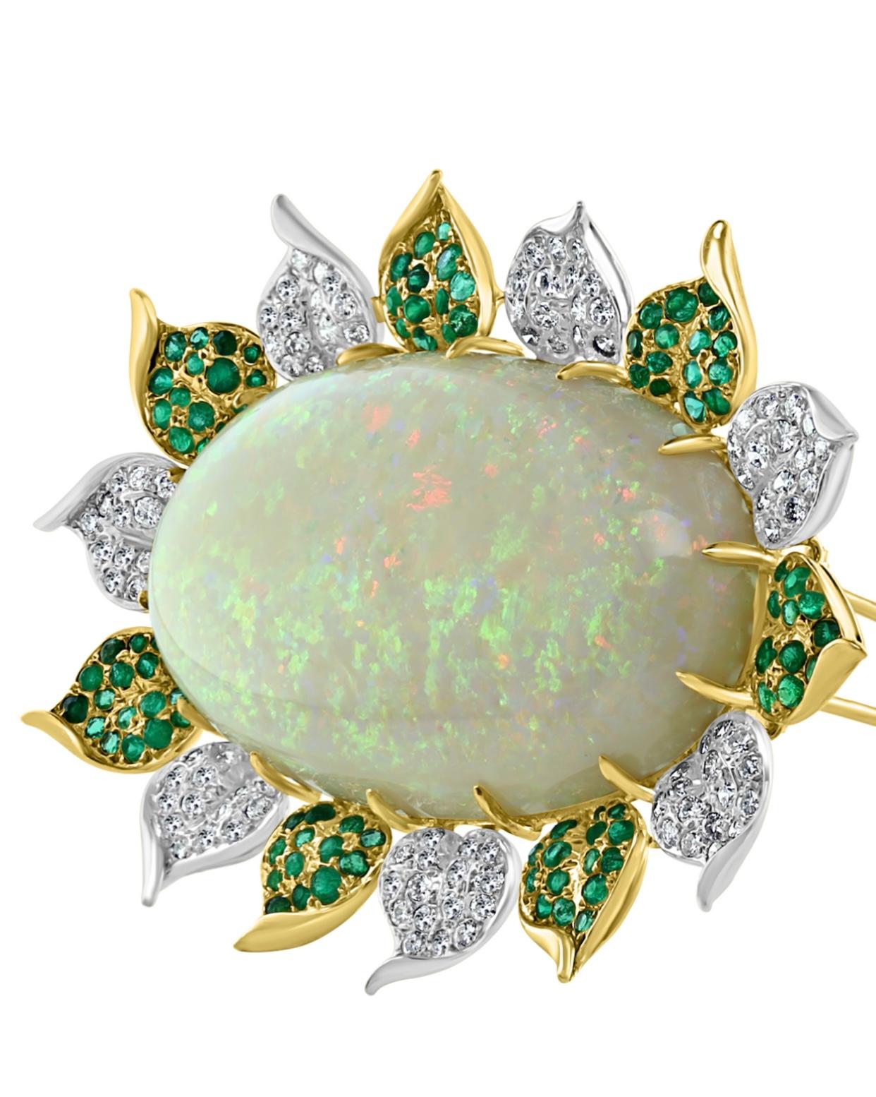 This stunning piece of jewelry is a Pin/Necklace made of 18 Karat yellow gold. It features a magnificent 107 Carat Oval Australian Opal as its centerpiece. Surrounding the opal are approximately 3.6 Carats of brilliant cut diamonds and approximately