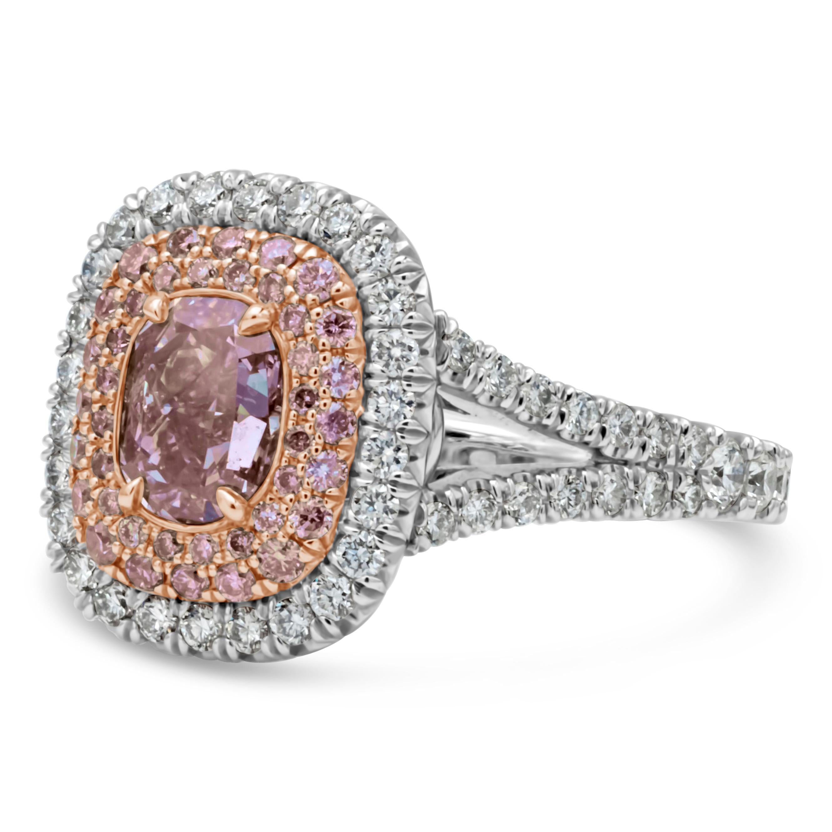 Well crafted and rare engagement ring featuring a colorful and vibrant 1.07 carat pink diamond that GIA certified as fancy purplish pink color, set in a four prong 18k rose gold basket. Center stone is surrounded by three rows of alternating pink