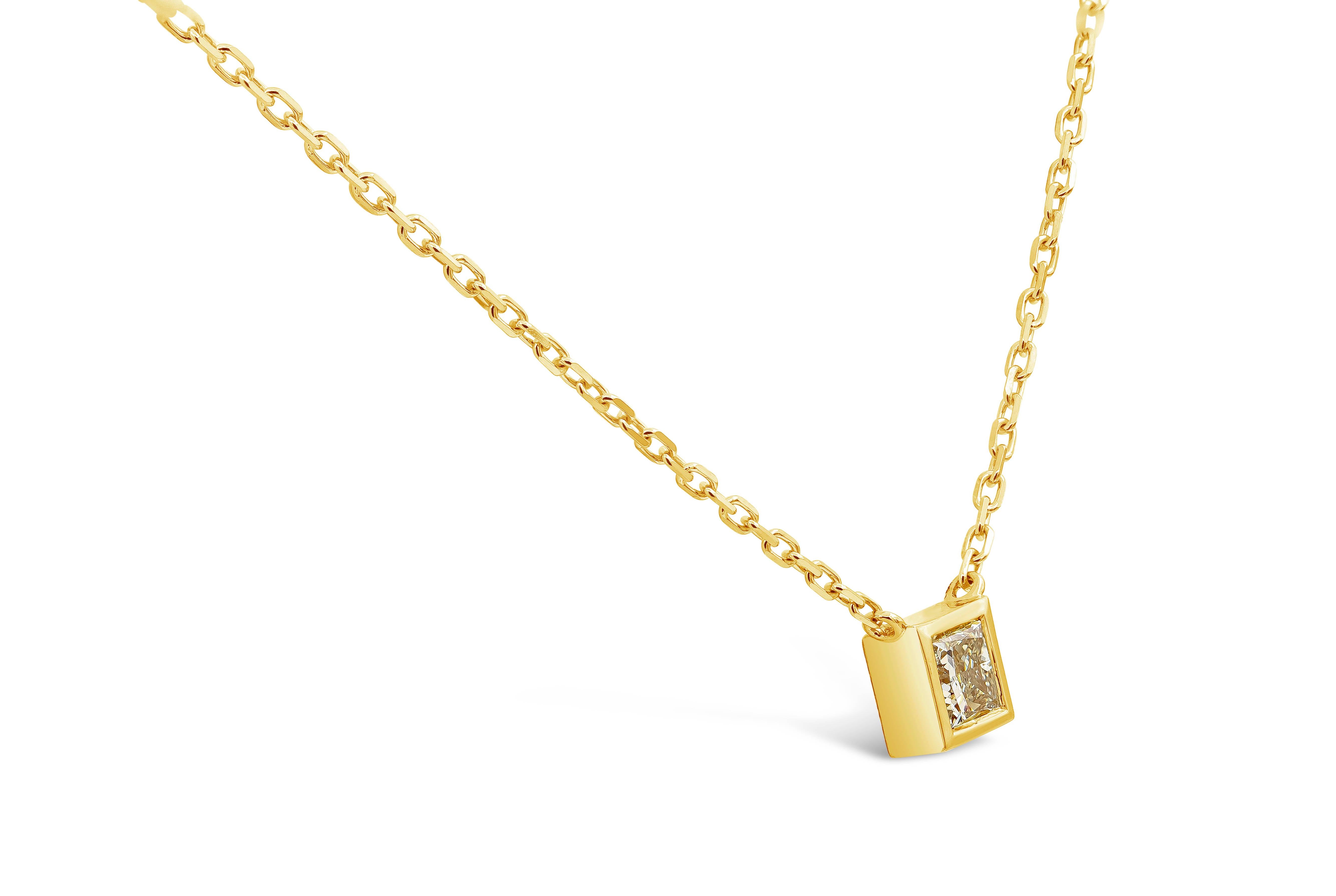 A simple and classic pendant necklace showcasing a 1.07 carats princess cut diamond, set in a polished bezel made in 14k yellow gold. Suspended on an adjustable 18 inch yellow gold chain. Diamond is approximately M-N color, SI1 clarity.

Roman