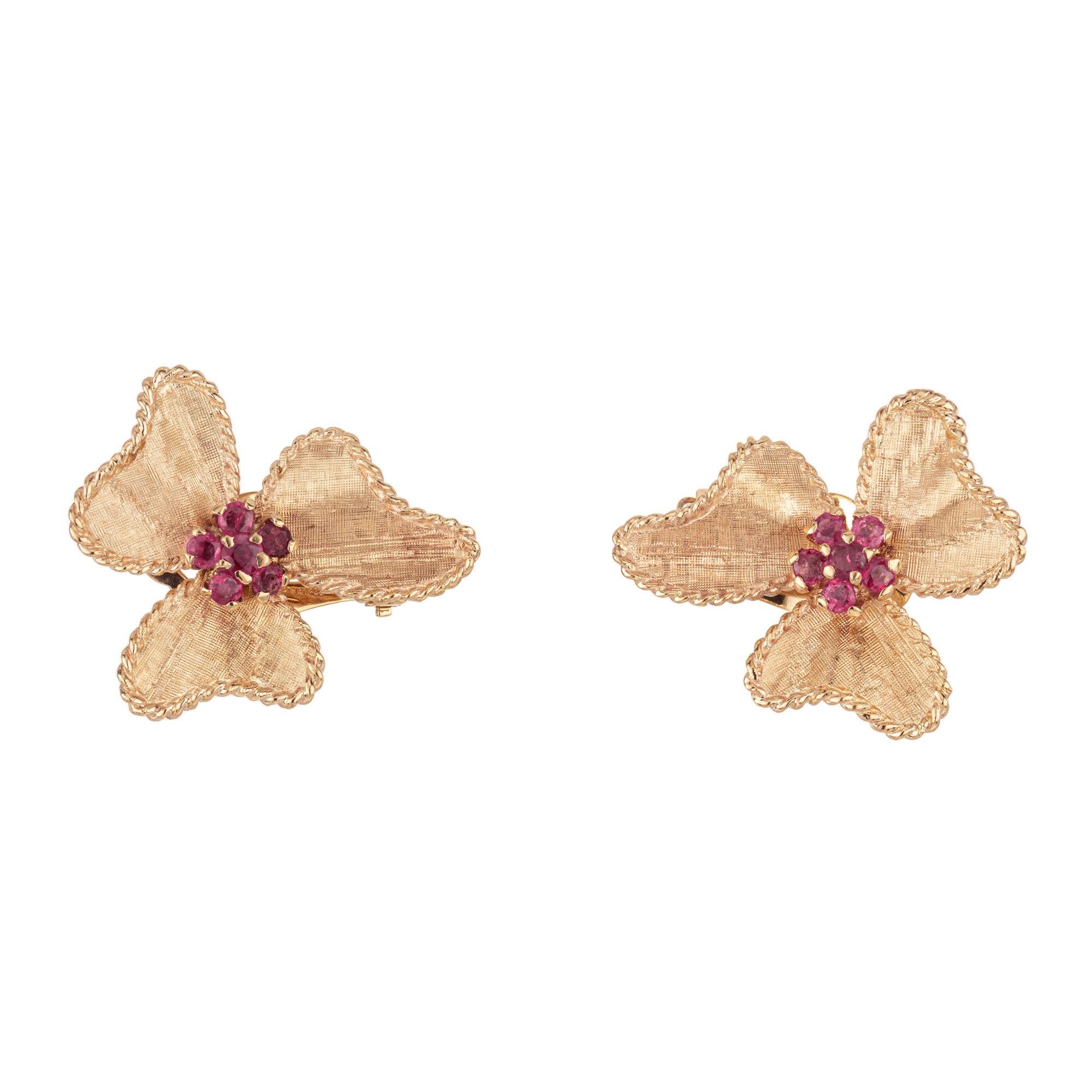 Vintage hand textured 1940s bow design earrings with natural pink red genuine ruby centers made out of 14k yellow gold. Set with a total of 12 round sapphires with an approximate total weight of 1.70cts. These elegant earrings have a rich gold