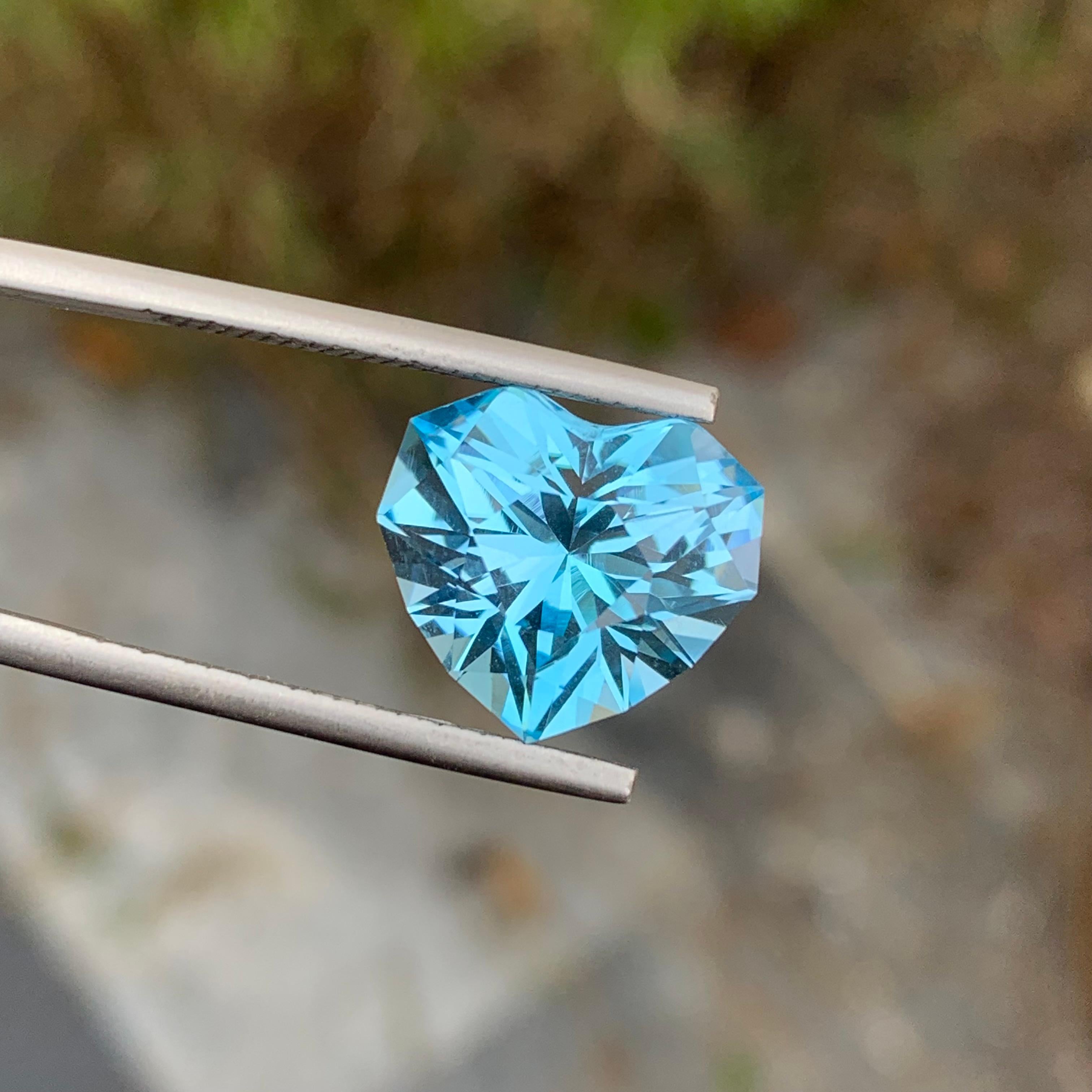Loose Blue Topaz
Weight: 10.70 Carats
Dimension: 12.4 x 13.7 x 9.5 Mm
Origin: Brazil
Colour: Blue
Certificate: On Demand
Shape: Heart 

Blue topaz is a stunning gemstone prized for its vibrant blue color and remarkable clarity. It belongs to the