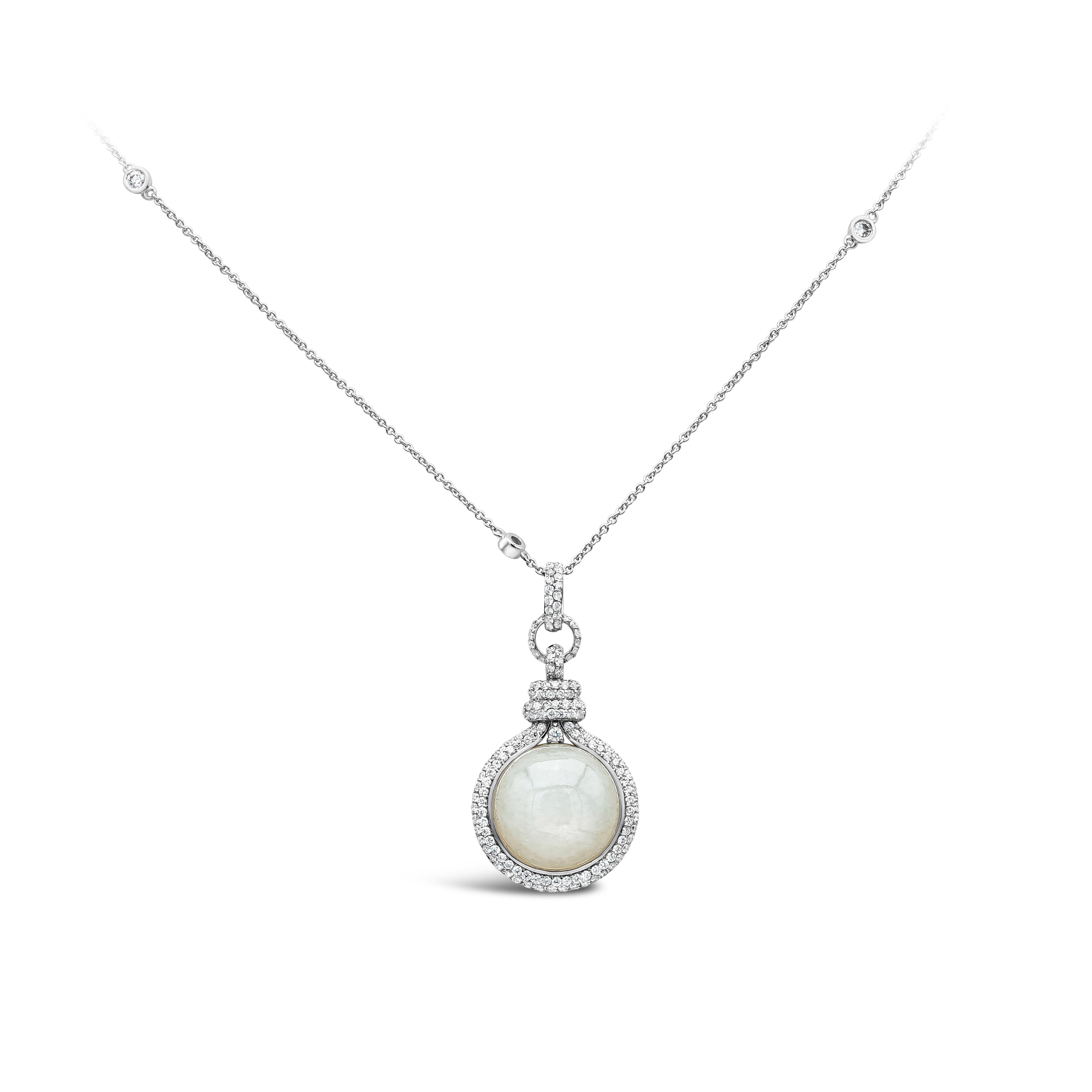 A fashionable pendant necklace showcasing a round white moonstone weighing 10.70 carat. Center stone is accented with bright round diamonds weighing 1.18 carats total, F color and VS clarity.
Made in 18 karats white gold.

Roman Malakov is a custom
