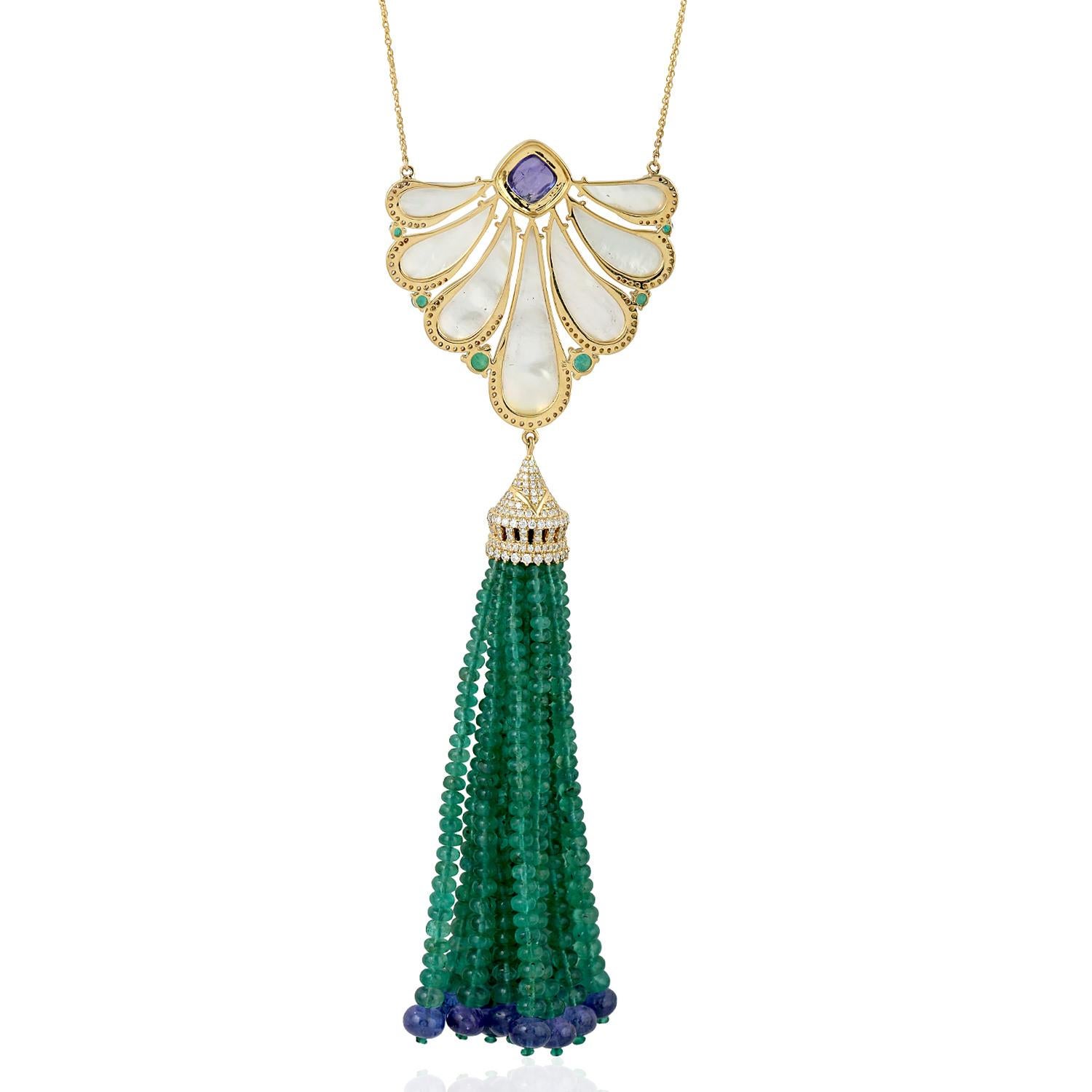 A stunning tassel necklace is handmade in 18K gold. It is set in 107.07 carats of emerald, 42.45 carats tanzanite, 17.59 carats mother of pearl and 2.01 carats of glimmering diamonds. 

FOLLOW  MEGHNA JEWELS storefront to view the latest collection