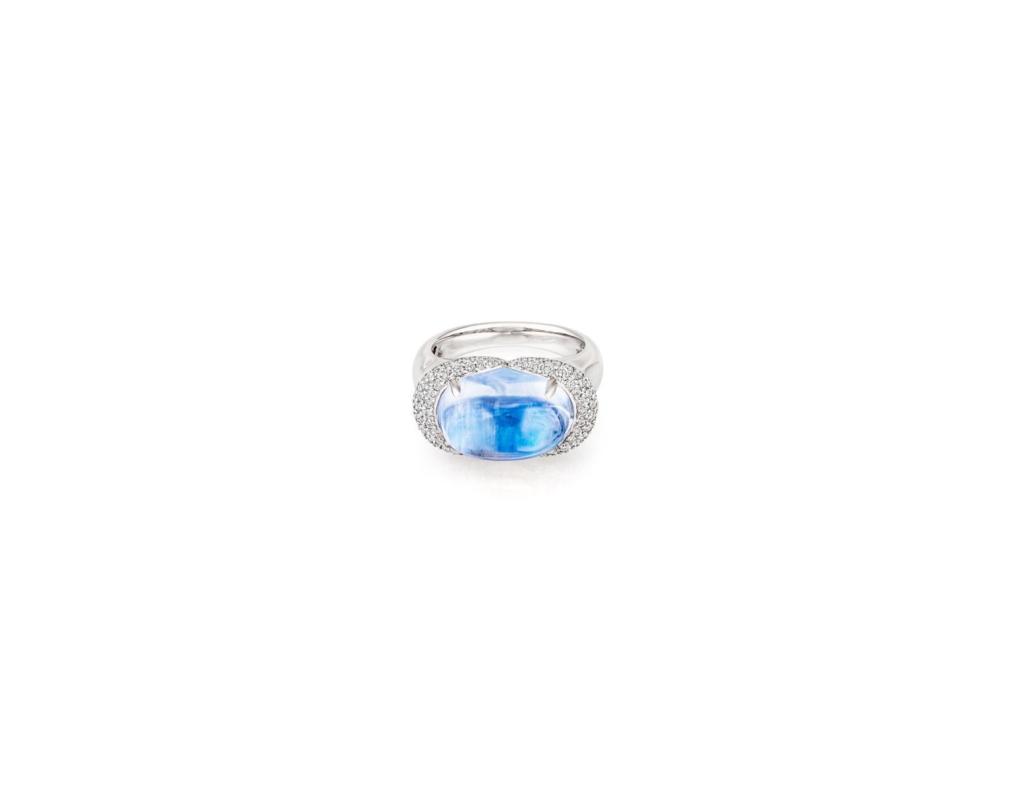 Beautiful 10.70ct Moonstone surrounded by .65ct Diamonds on 18kt White Gold. With the highest quality materials and vintage-inspired design, this ring will make you feel like you're a royal in the Renaissance Age. Only one available. 