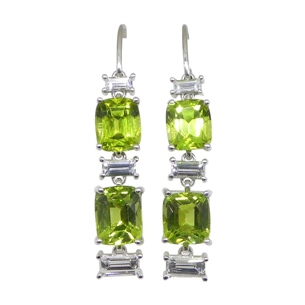  

Indulge in the captivating allure of these exquisite 10.70ct Peridot and 1.80ct White Sapphire Earrings, delicately set in the elegance of 14k White Gold.

 

The focal point of this stunning piece rests on the mesmerizing Peridot gemstones,