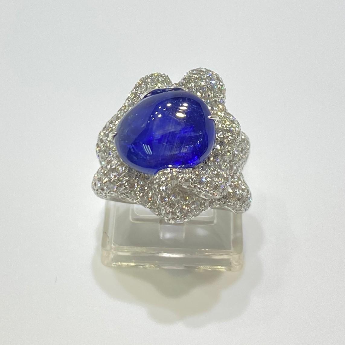 A stunning free form 10.71 carat royal blue Ceylon Sapphire ring, set in white gold ring. The ring showcases excellent craftsmanship. The sapphire have slight inclusions. The mounting is handcrafted based on the free form shape of the sapphire. The