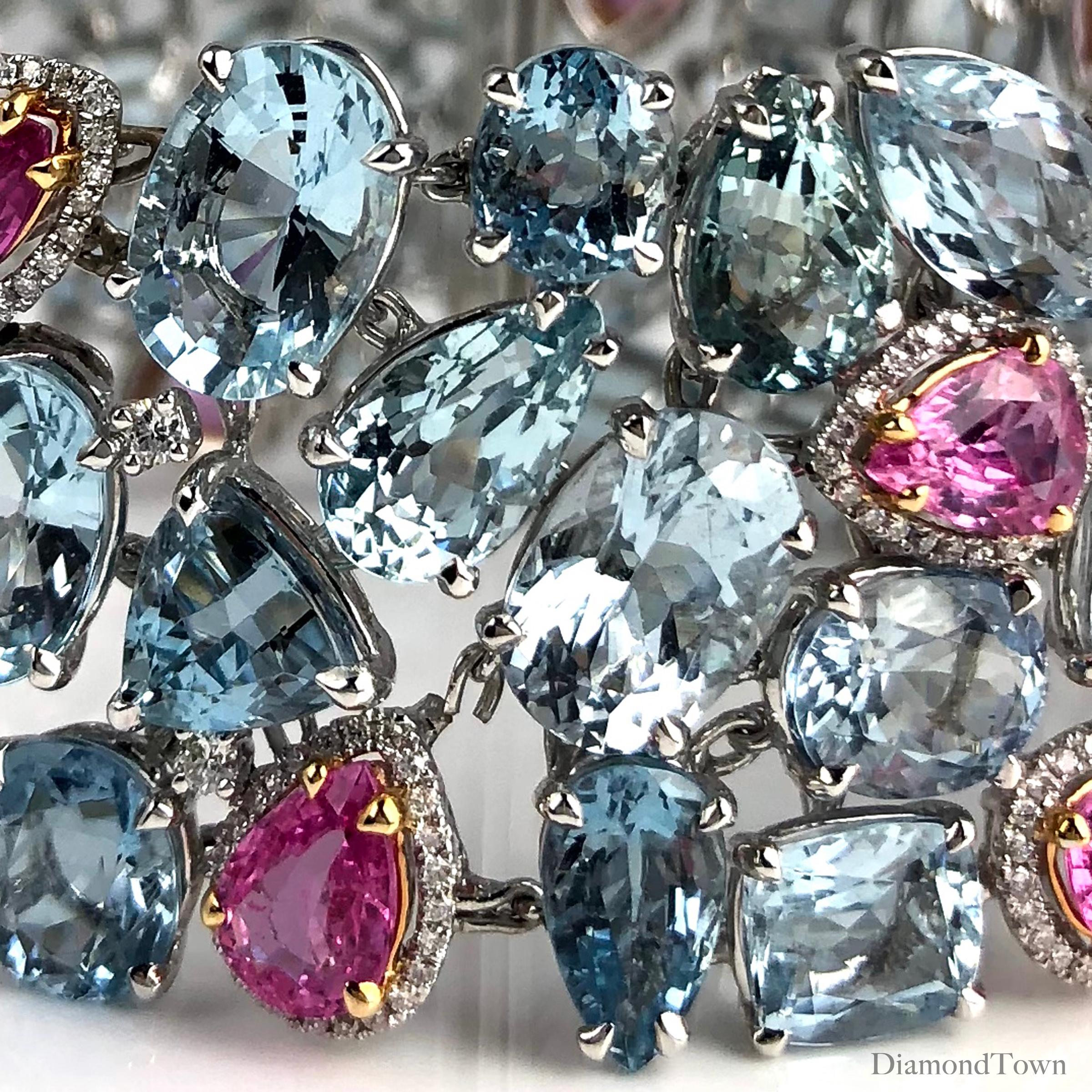 This gorgeous bracelet features GIA Certified aquamarine and pink sapphires, with diamond accents throughout. The stones are delicately arranged into a flexible cuff setting. A gorgeous color accompaniment to any event.

Aquamarine: 96.43