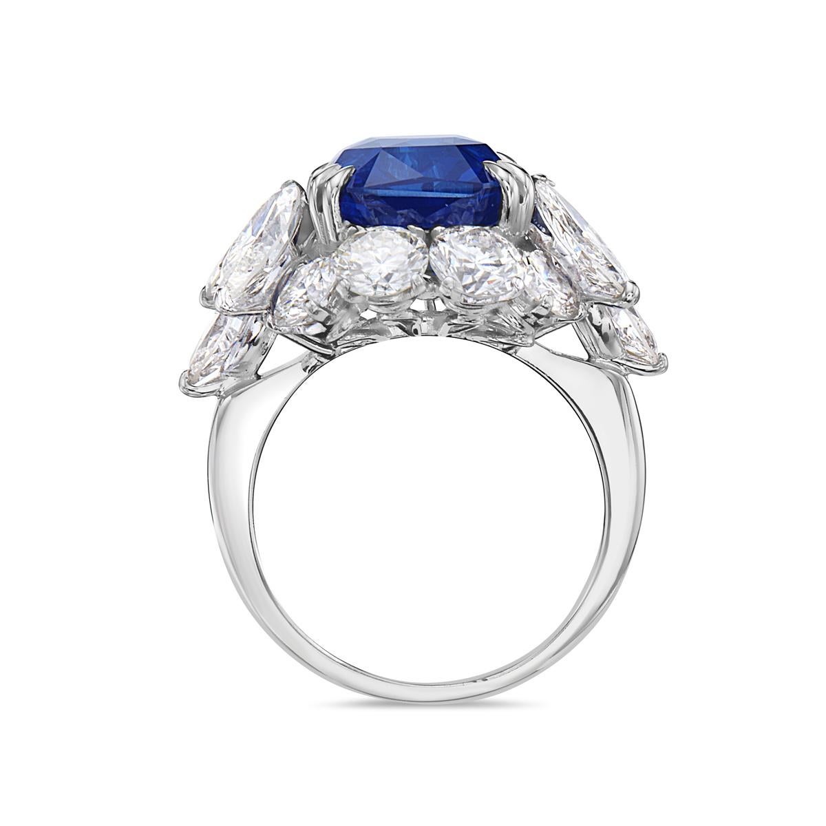 This cocktail ring features a 10.73 GRS certified vivid royal blue Madagascar heat modified octagonal radiant step cut sapphire, 8 round brilliant diamonds, and 6 Marquise diamonds set in 18K white gold. Size 6.

Resizeable upon request.

Viewings