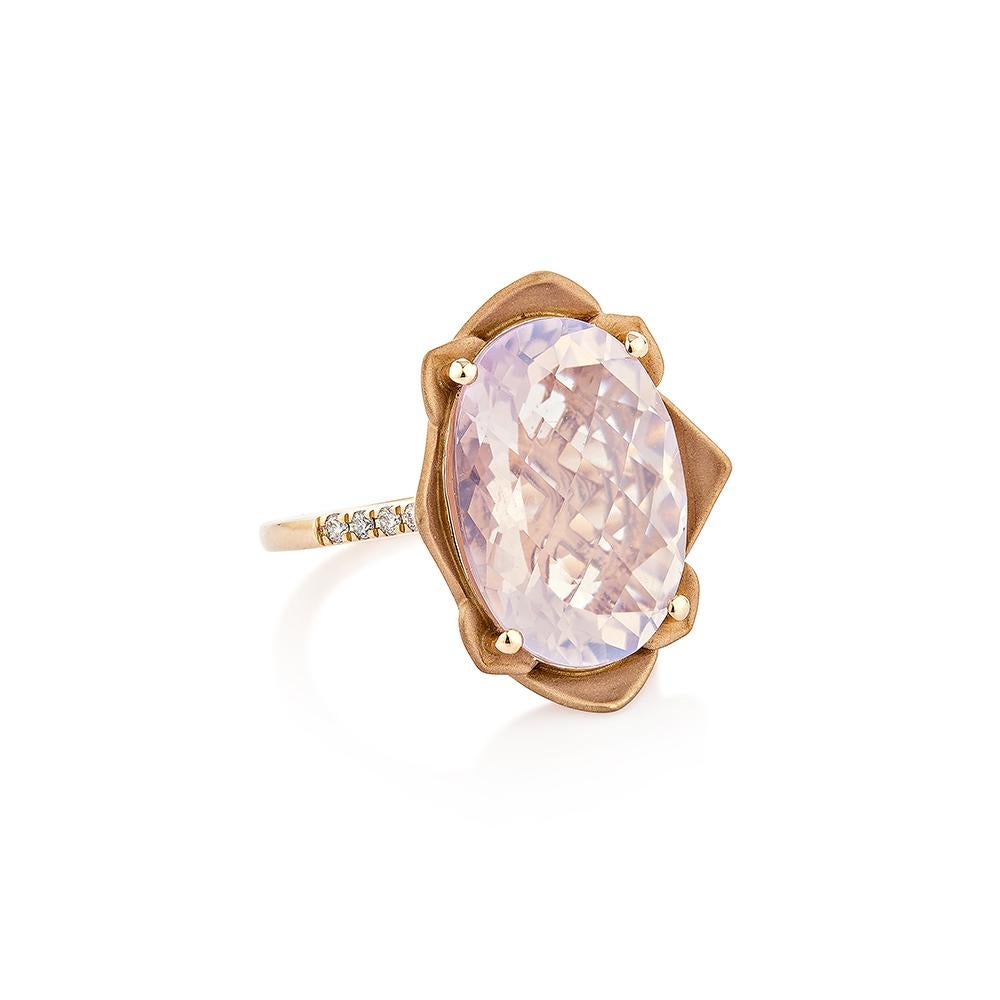 This Fancy Lavender Quartz Ring Cushion shape with Chackerboard cut. Accented with diamonds this ring is made in rose gold and present a beautiful yet elegant look.
  
Lavender Quartz Fancy Ring in 18Karat Rose Gold with White Diamond.   

Lavender