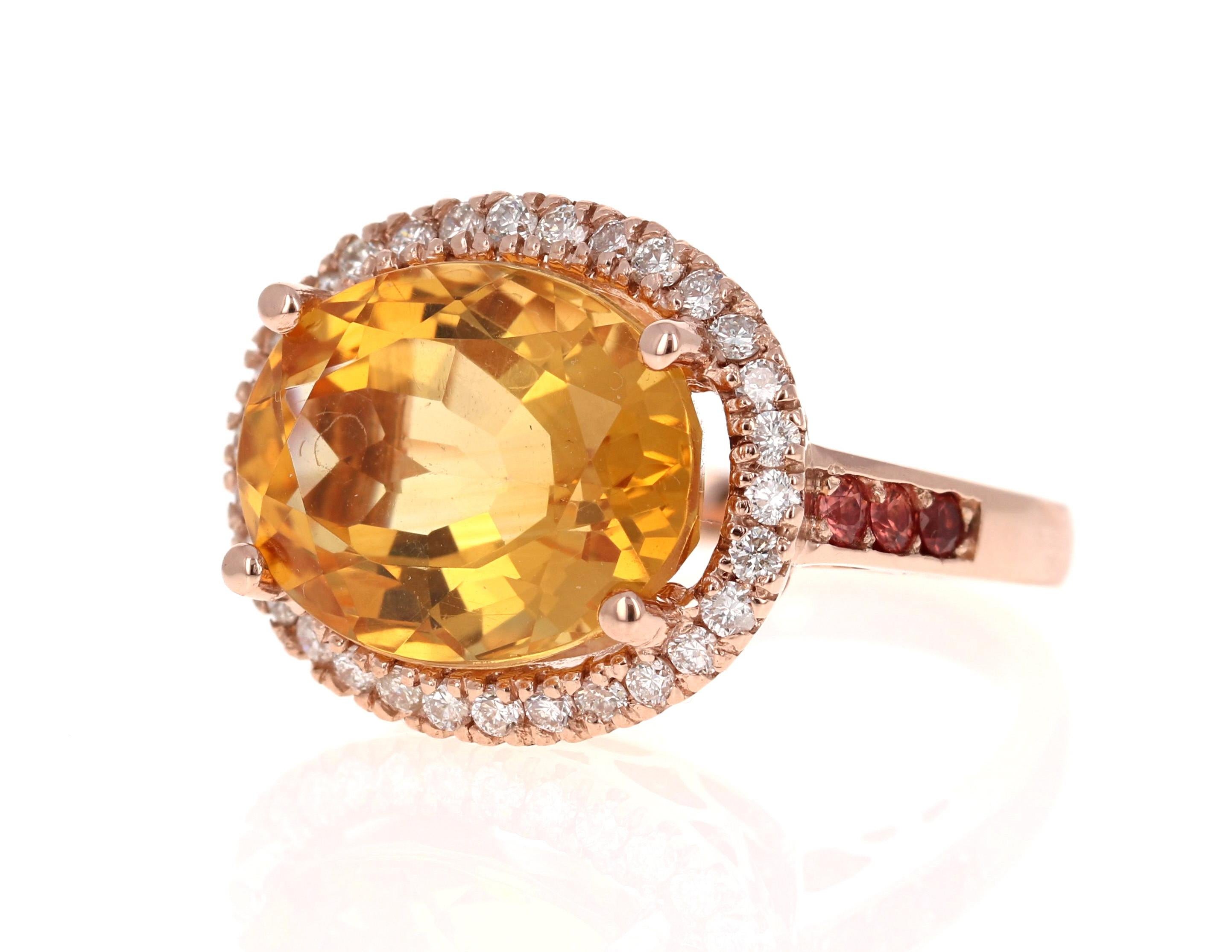 A Stunning and uniquely designed beauty to say the least! 

This magnificent ring has a bold Oval Cut Citrine that is blazing yellow! It weighs 9.90 Carats and is surrounded by a beautiful halo of 30 Round Cut Diamonds that weigh 0.56 Carats.