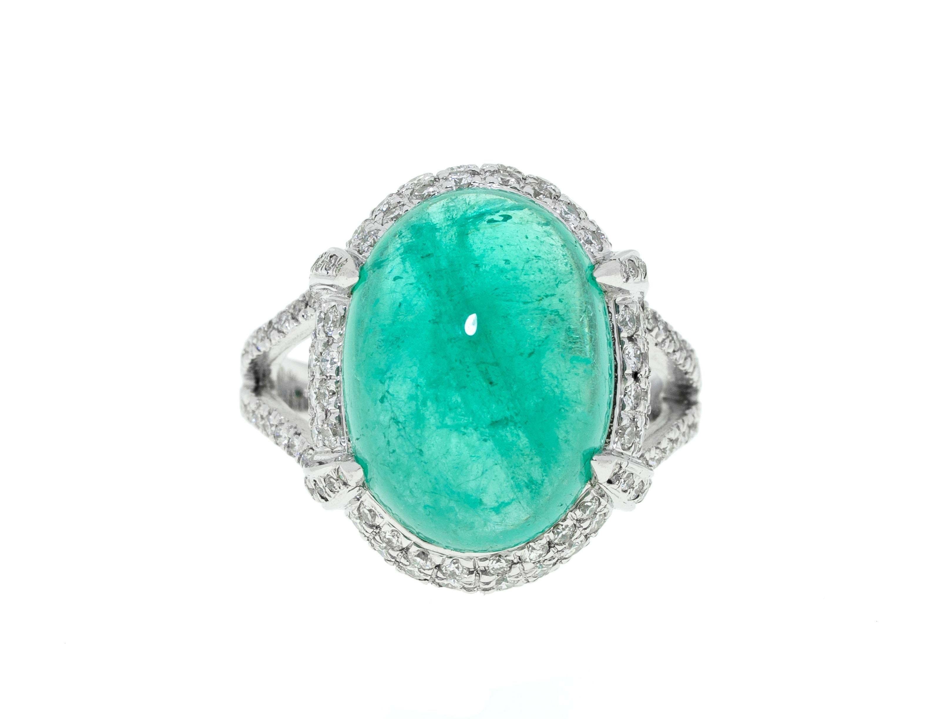 You can never go wrong with emerald and diamond 18 K white gold jewelry. The 9.8 Ct cabochon gem cut of this rare light emerald beautifully shows the aquamarine green hue of the precious stone with lovable inclusions that make the gem one of a kind