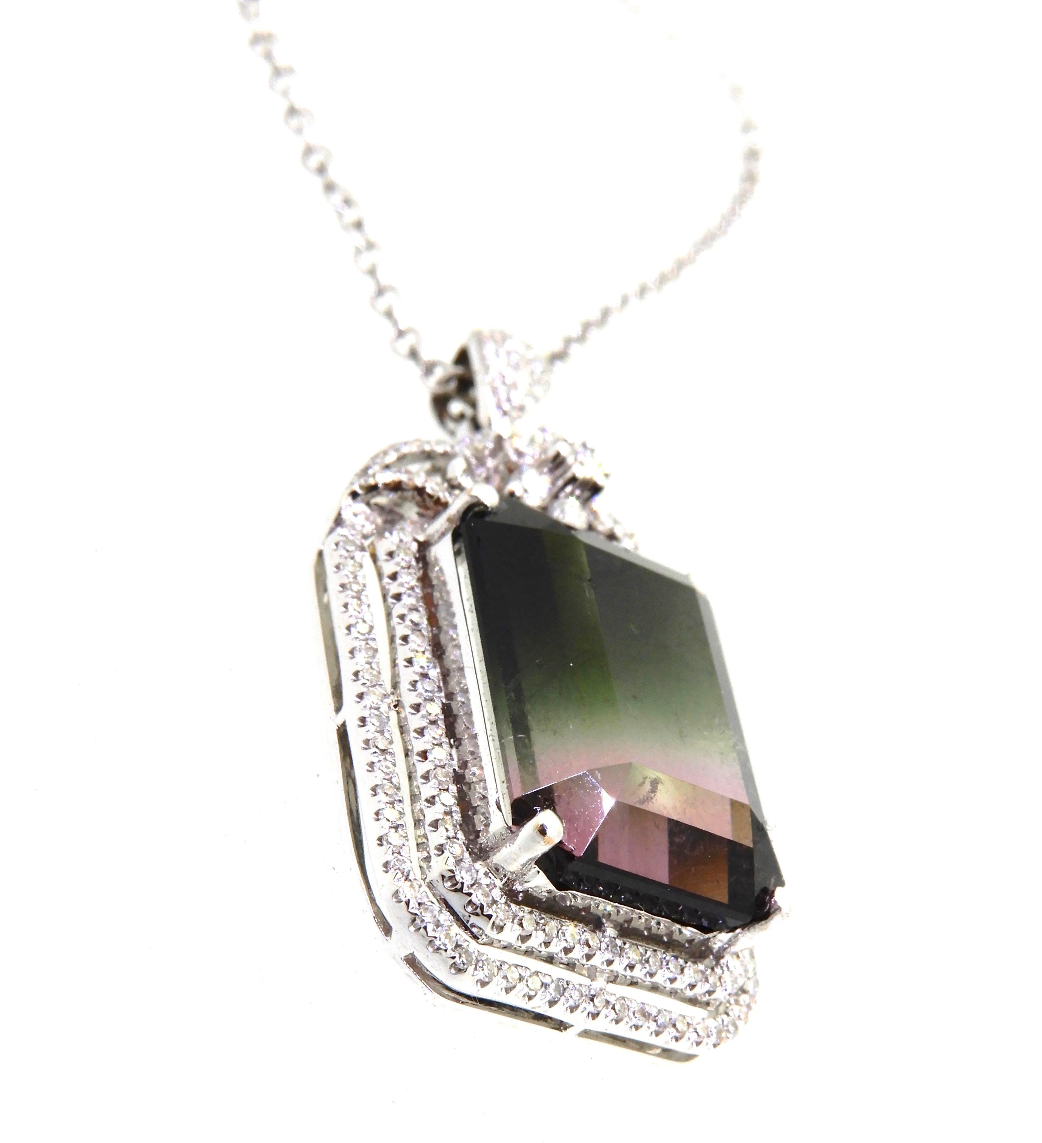 This substantial and show-stopping 10.75 Carat Emerald Cut Watermelon Tourmaline and Diamond Pendant is a must have in your jewellery chest. Feminine, colourful and eye catching. 

The Pendant is a central 4-claw set emerald cut 