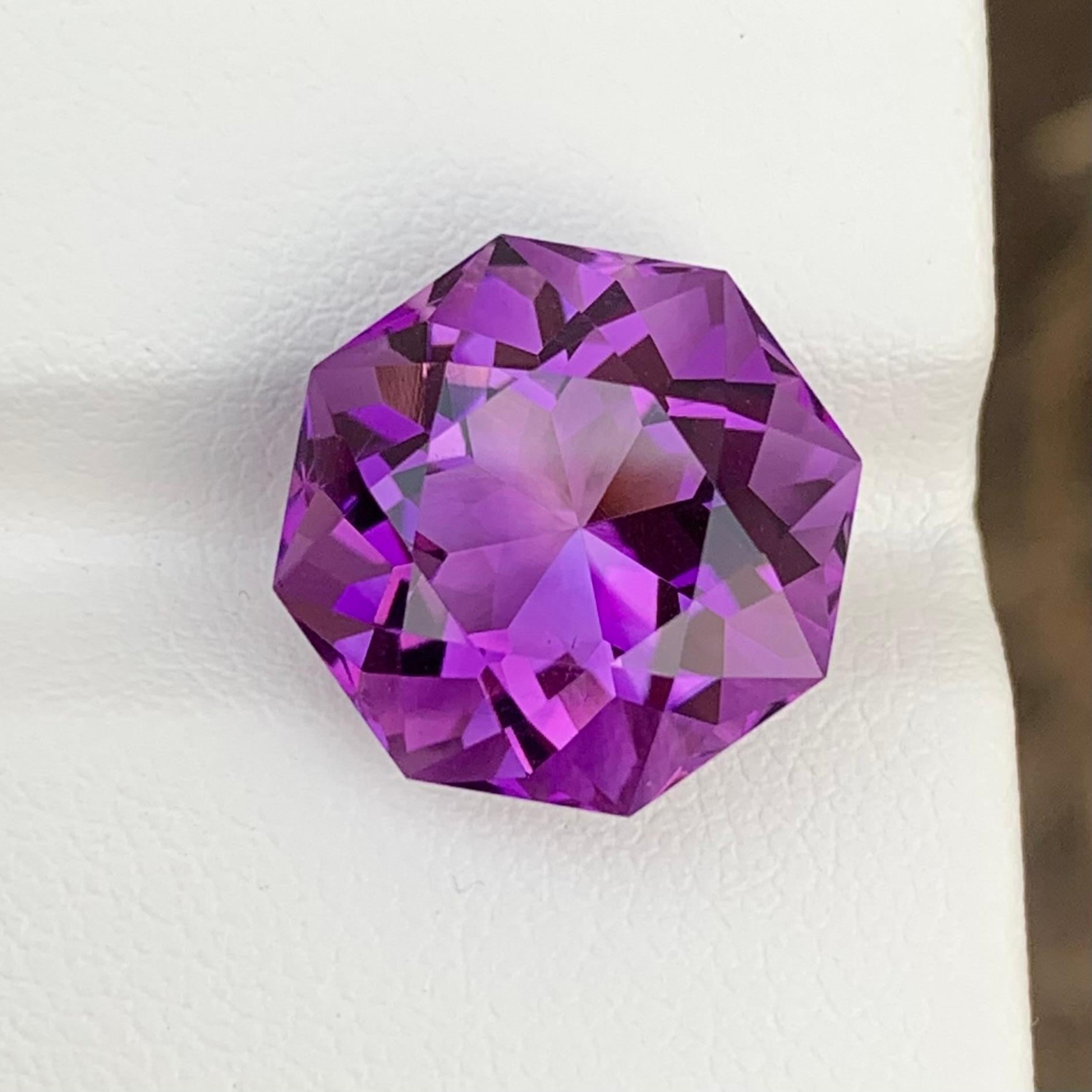 Loose Amethyst 
Weight: 10.75 Carats 
Dimension: 14.1 x 13.9 x 10.1 Mm 
Shape: Octagon 
Origin: Brazil 
Colour: Purple 
Treatment: Non
Certificate: On Demand 

Amethyst, a regal and captivating gemstone, has long been revered for its enchanting
