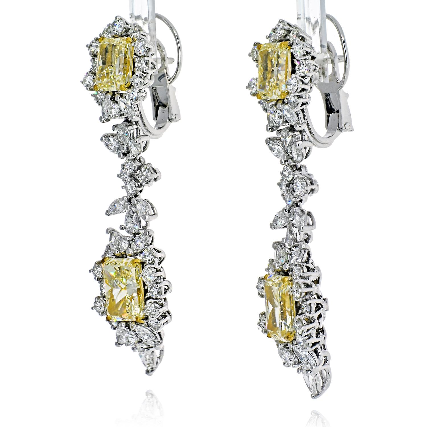 Exceptional Yellow and White Diamond Earrings centering four Radiant-Cut Yellow Diamonds of VVS1/VVS2 clarity totaling 10.75 Carats, framed by an additional 7.68 Carats of Marquis Cut, Pear Shape, and Round-Brilliant Cut Diamonds, and set in 25.1