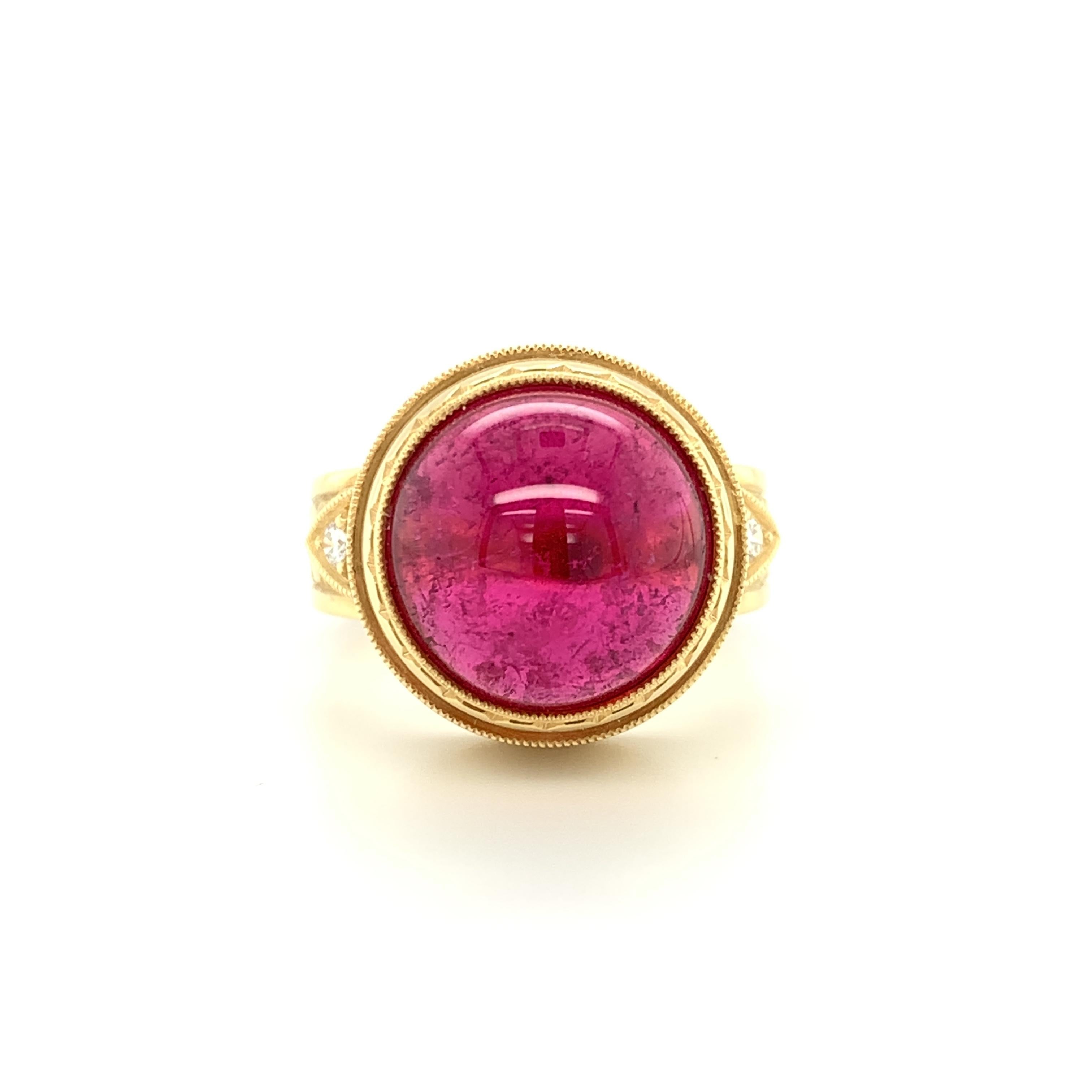 This gorgeous ring features a fine 10.75 carat rubellite tourmaline cabochon of extraordinary color and quality.  A stunning gem with vibrant, rich color and excellent clarity, it is beautifully bezel set in an exquisite ring that showcases a