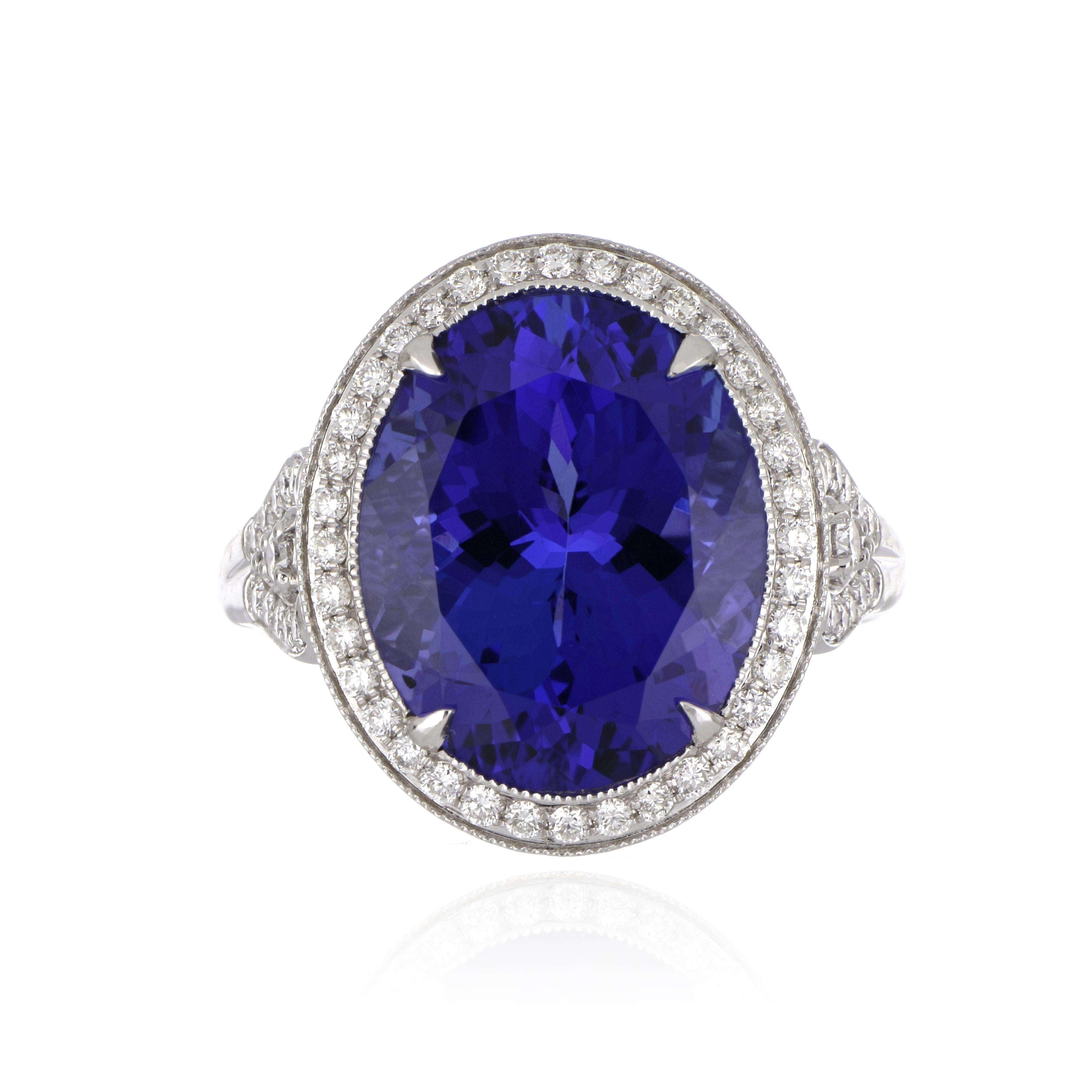 Elegant and exquisitely detailed 18K Ring, centre set with 10.75 Ct Tanzanite, surrounded by and enhanced on shank with micro pave Diamonds, weighing approx. 0.65 total carat weight. Beautifully Hand crafted in 18 Karat white Gold.

Stone Size: 15.4
