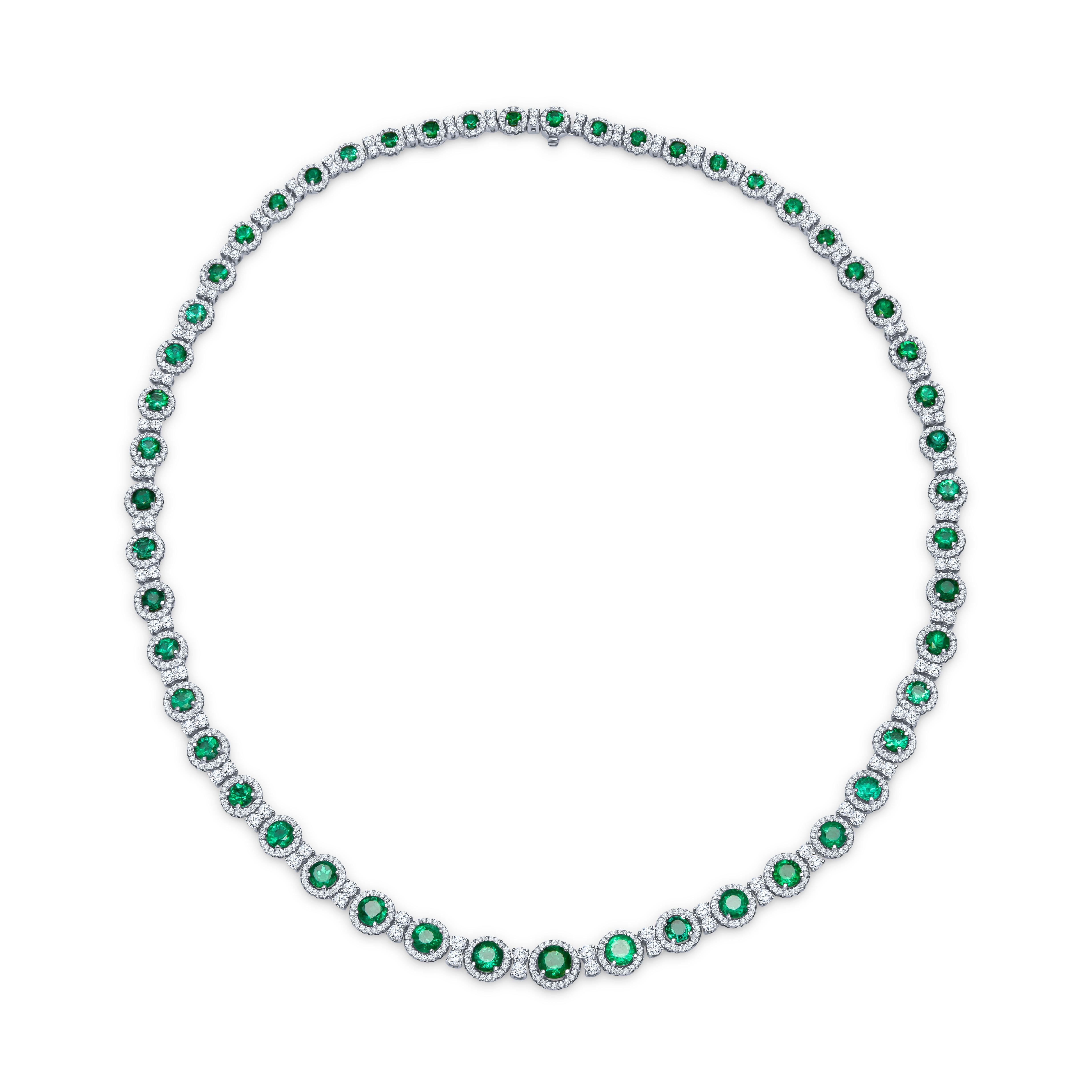 Fine emerald necklace containing 10.76 carats total in round natural emeralds with 6.95 carats total weight of round brilliant cut diamonds surrounding the emeralds. Elegantly set in an 18K white gold necklace with a length of 16.5