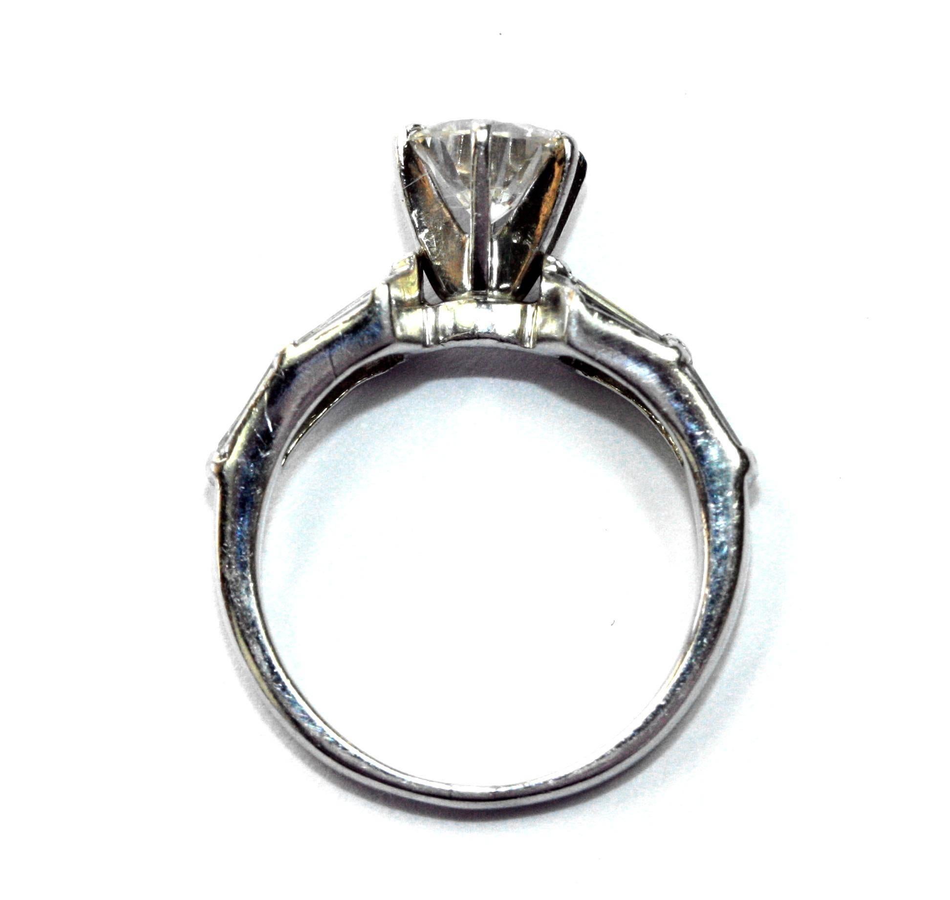 Contemporary 1.08 Carat Diamond Solitaire in Platinum with Baguette Shoulders For Sale