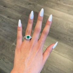 1.08 Carat Emerald Three-Stone Diamond with Halo Ring 18 Karat Gold