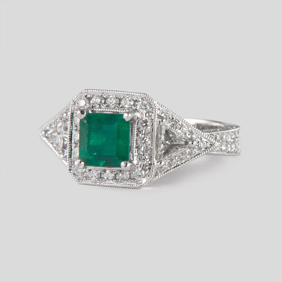 Contemporary 1.08 Carat Emerald Three-Stone Diamond with Halo Ring 18 Karat Gold For Sale