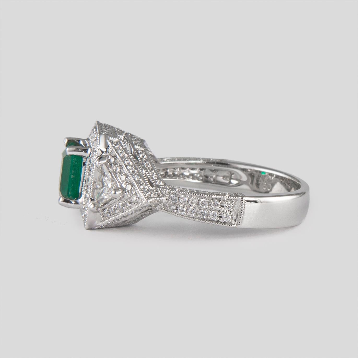 Emerald Cut 1.08 Carat Emerald Three-Stone Diamond with Halo Ring 18 Karat Gold For Sale